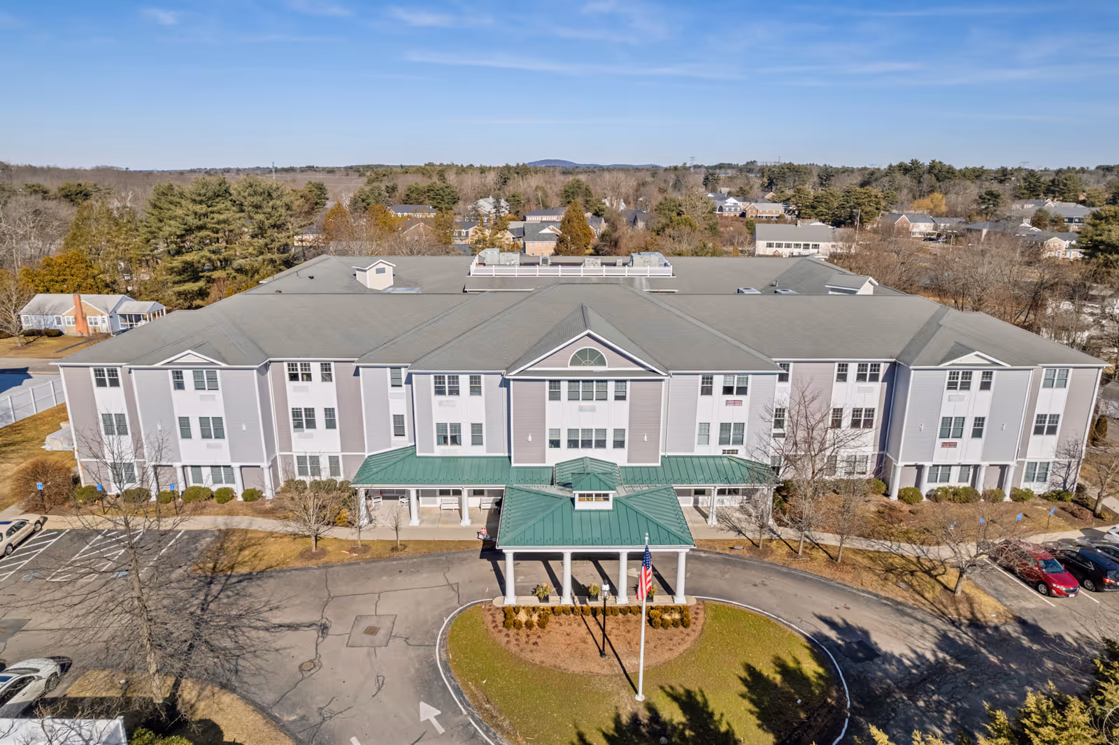 Aerial view of Brookmeadow at Cobb Corner, a multi-story senior living building, front entrance.