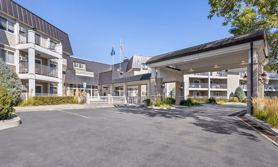 Exterior view of Westpark Village senior living facility with a covered entrance.