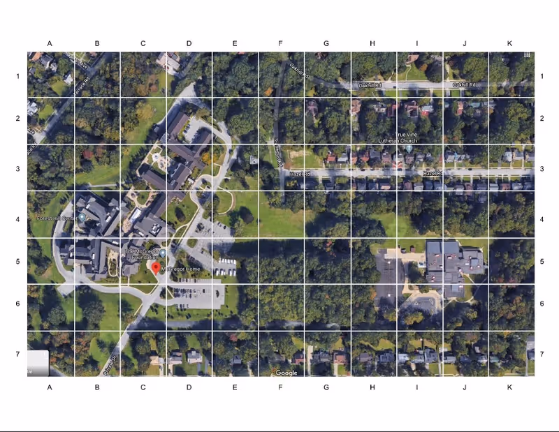 Aerial view of McGregor Assisted Living campus with buildings, parking, roads, and trees