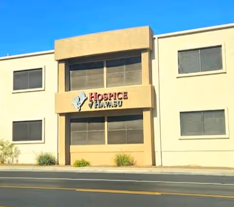 Beige two-story building with a front sign reading Hospice of Havasu.