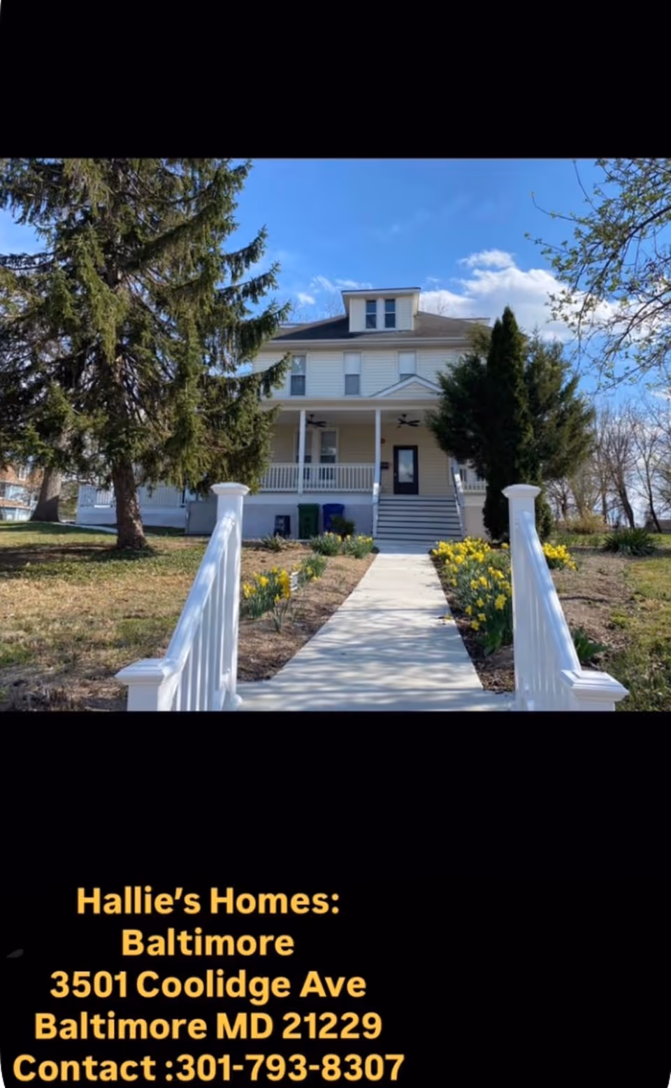 Front exterior of Hallie's Homes Baltimore with a walkway, porch, and landscaped yard.
