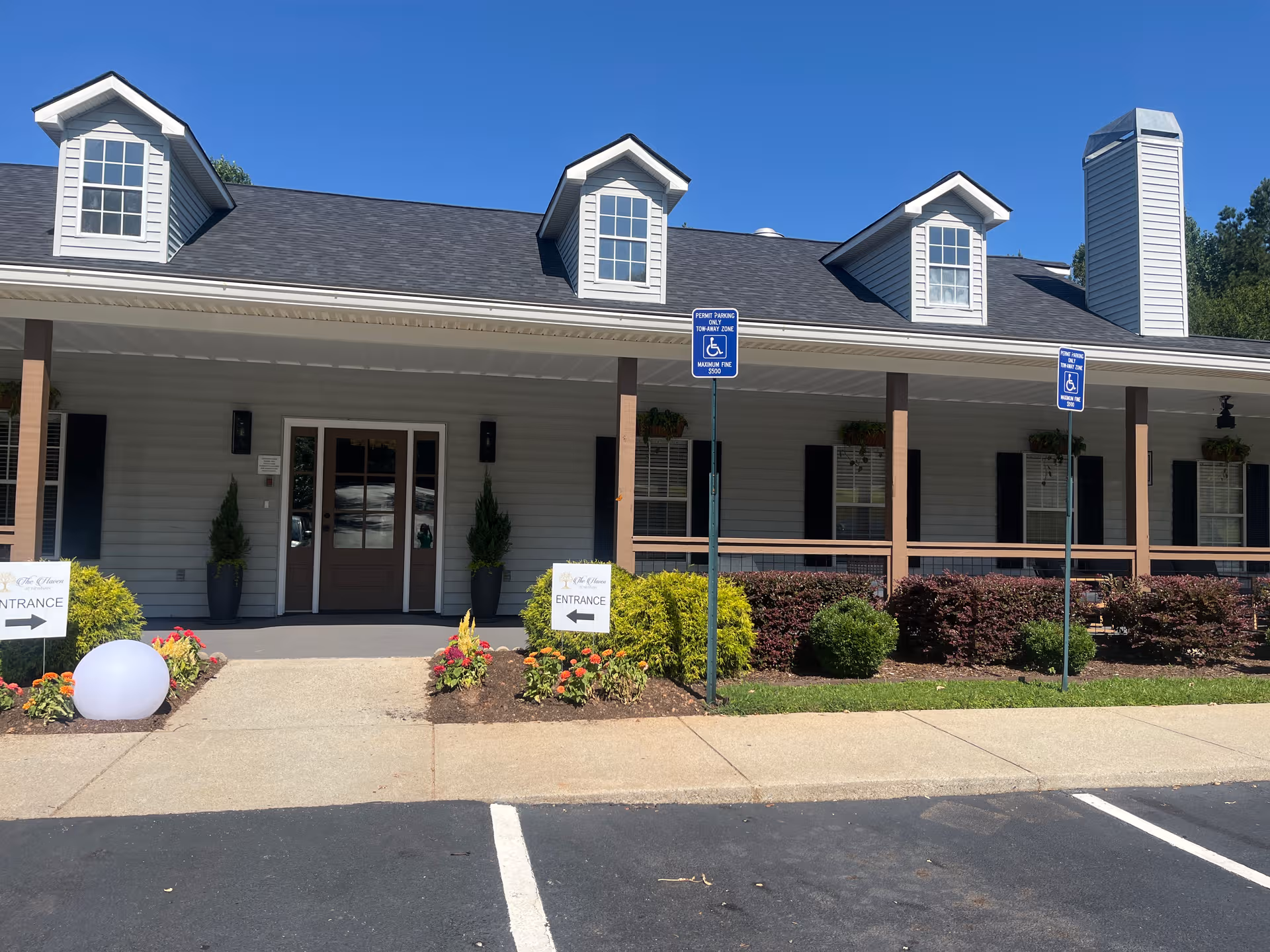 Front view of The Haven at Newnan senior living facility entrance with parking.