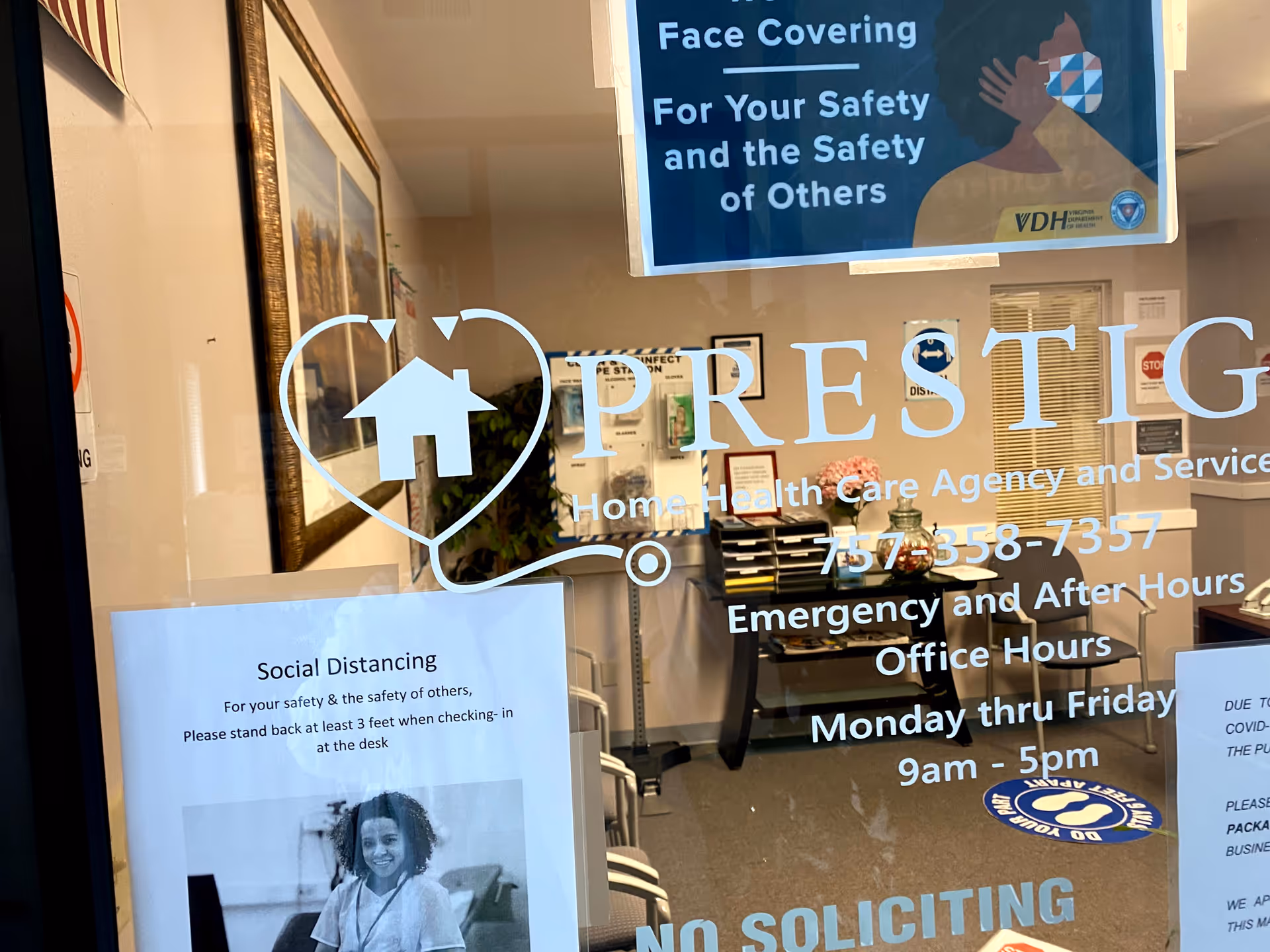 Prestige Home Health Care Agency reception area visible behind glass door with branding and safety posters.