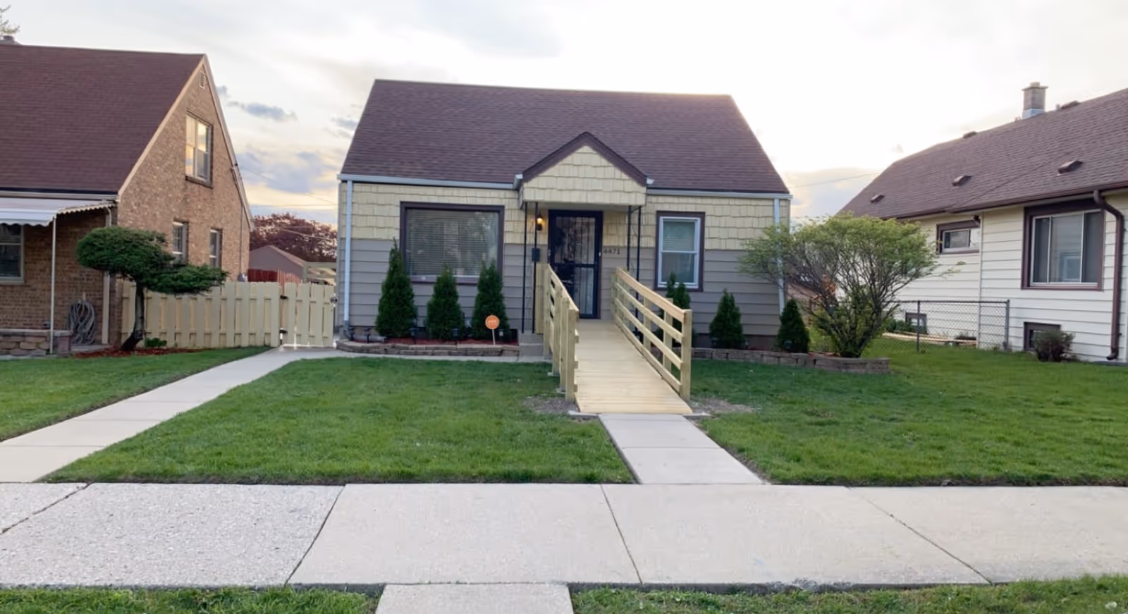 Front exterior of a single-story facility with a ramp to the entrance and lawns.