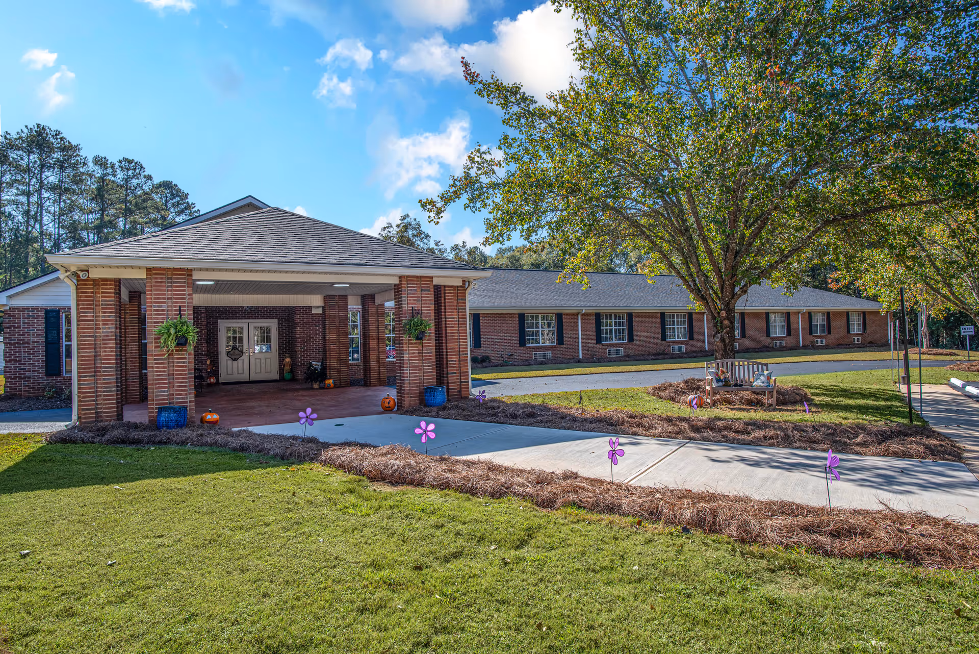 Front view of Haven Memory Care Community of Snellville exterior with brick building and entrance.