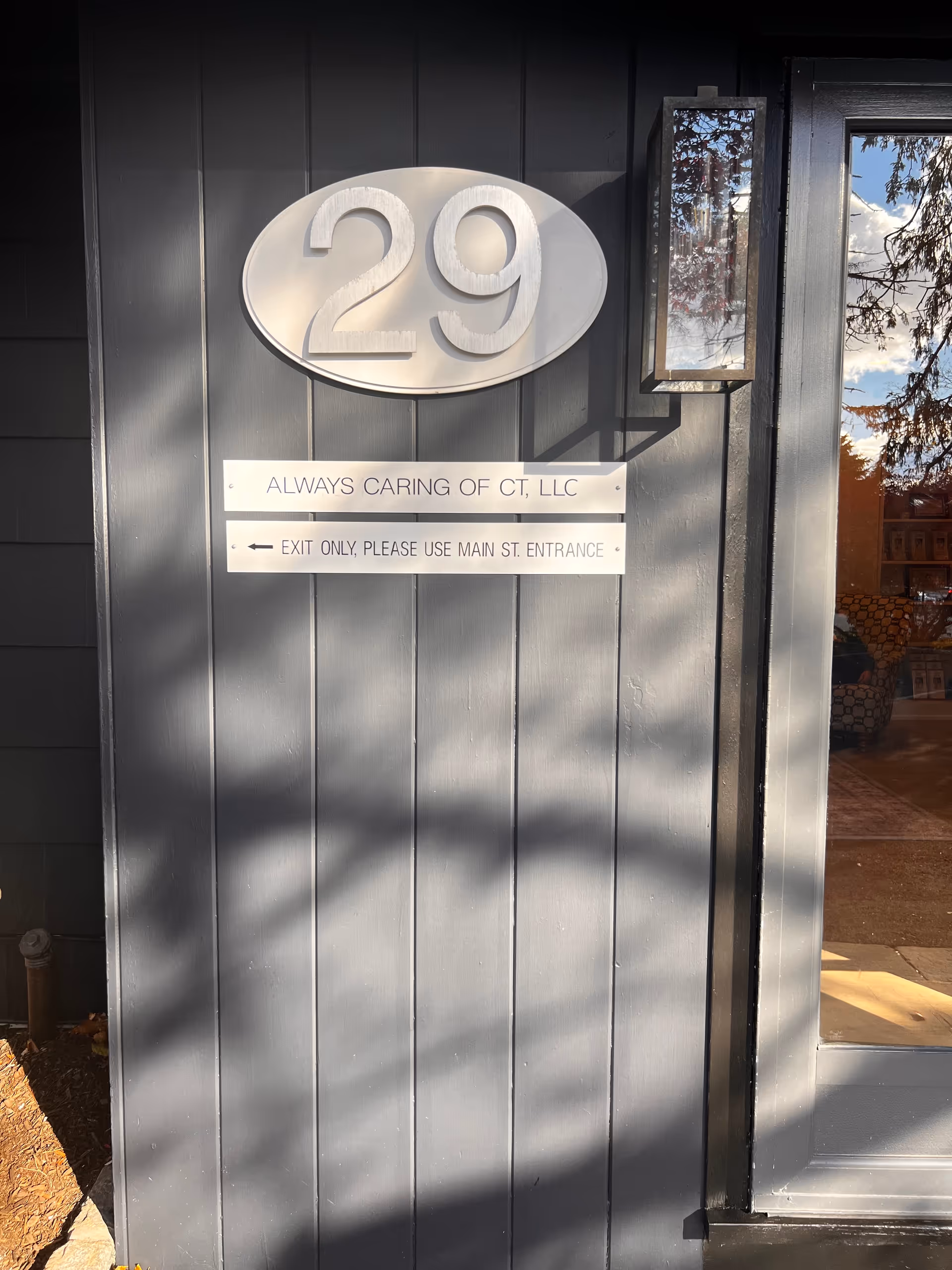 Exterior entrance of Always Caring Of CT, LLC with large 29 sign.