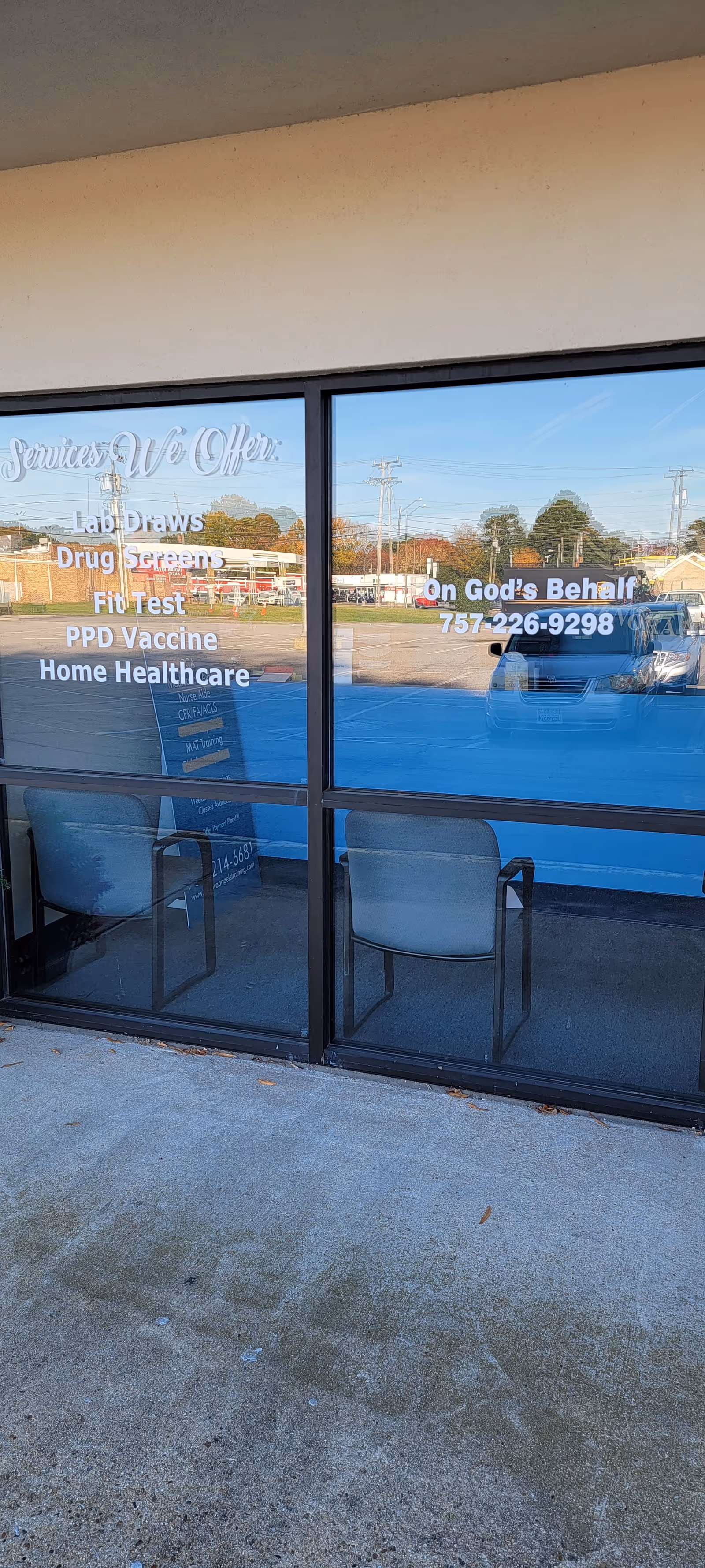 Storefront window of Expert Healthcare displaying services and two chairs inside.