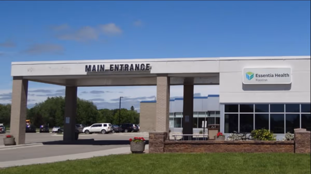 Exterior view of Essentia Health Fosston main entrance and parking lot.