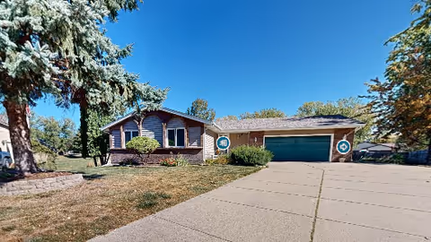 Front view of Maple Care Homes of Apple Valley, a single-story residence with a two-car garage.