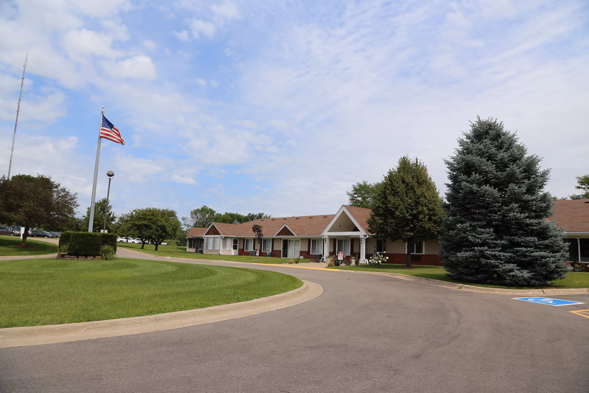 Front exterior of a single-story retirement residence with a curved driveway.