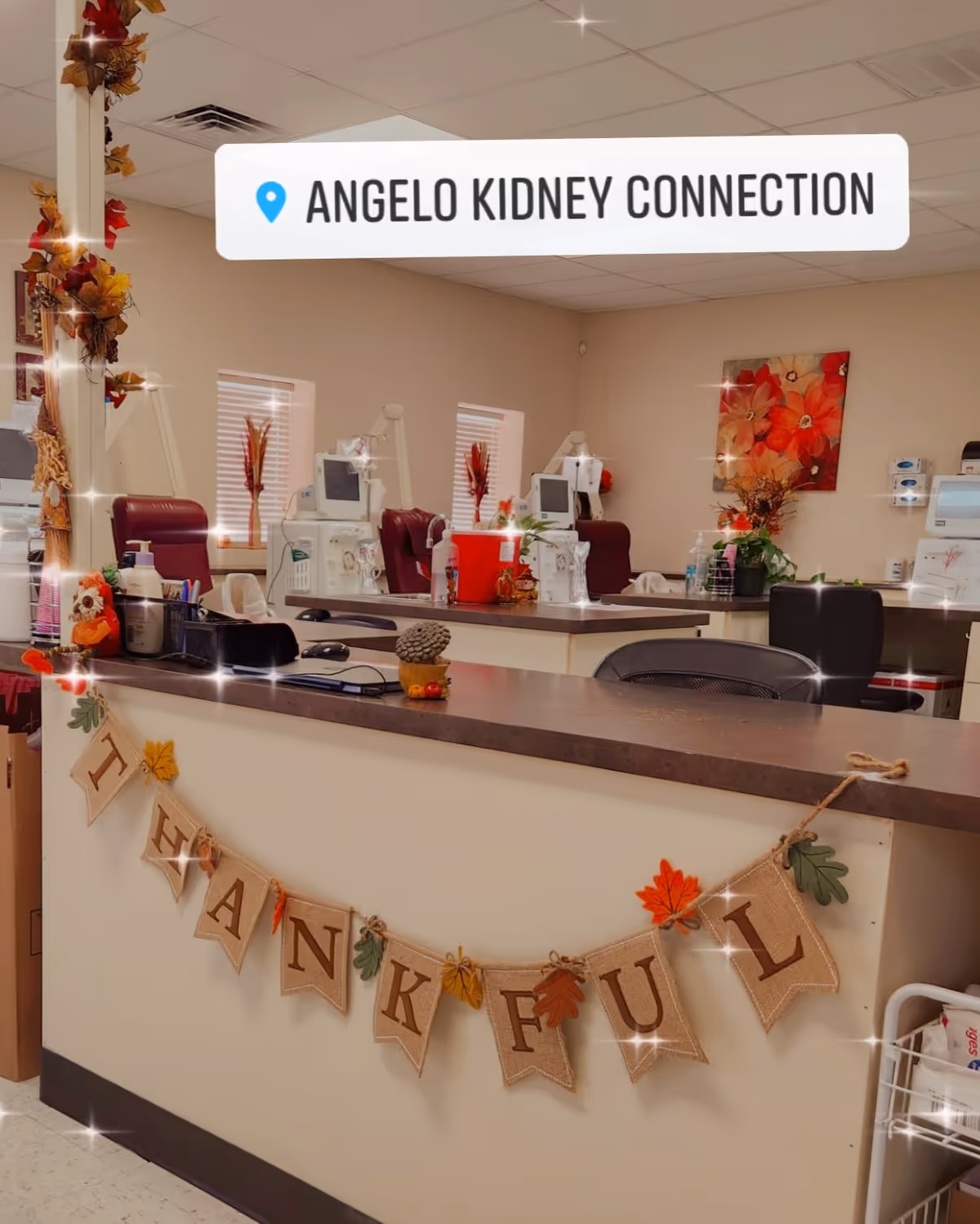 Interior reception area with a counter, dialysis machines, and autumn decor at Angelo Kidney Connection.