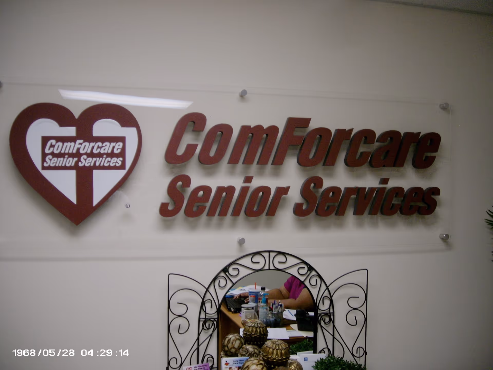Interior wall sign displays ComForCare Senior Services logo.
