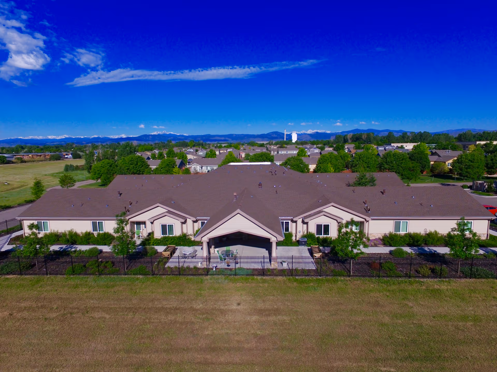 Aerial view of Aspen House senior living campus with a central entrance and landscaping.