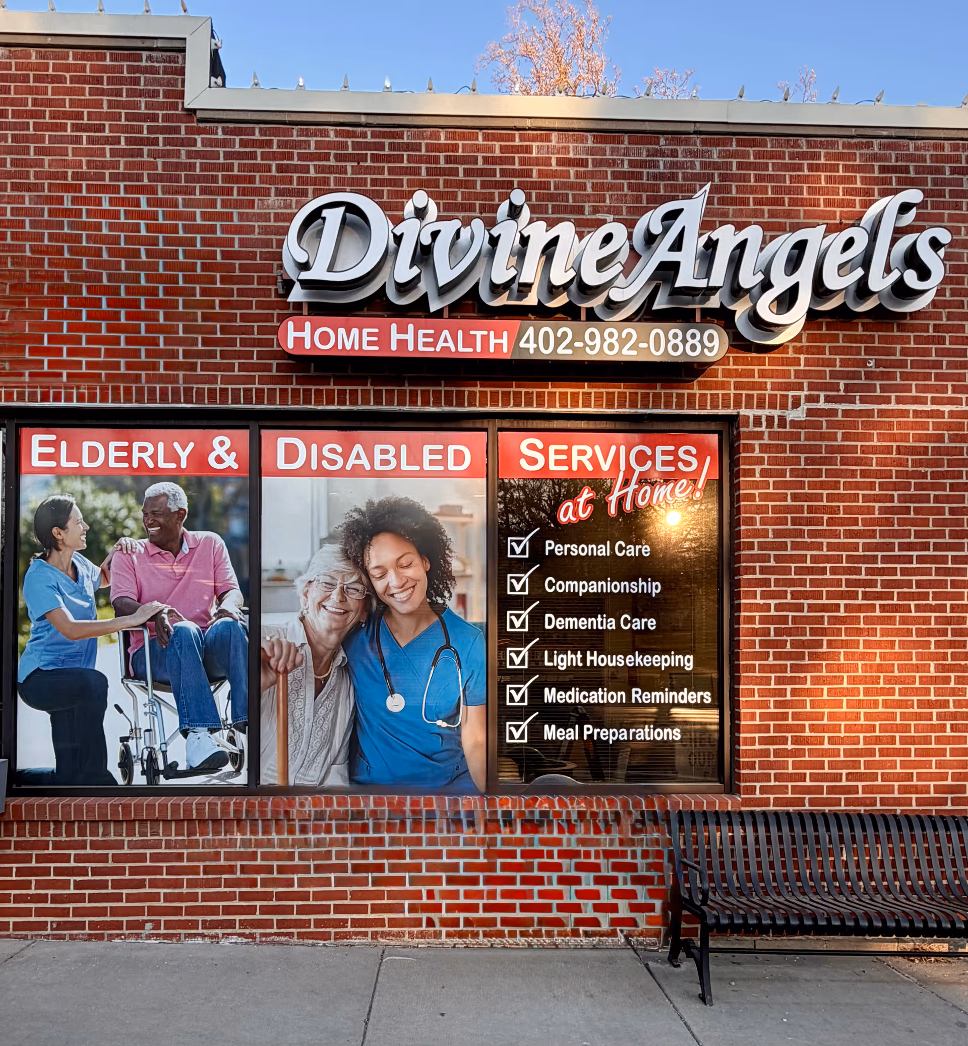 Brick storefront with Divine Angels Home Health signage and care-themed window graphics.