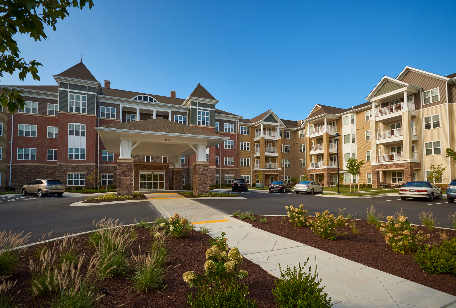 The Lutheran Village at Miller's Grant exterior with covered entry, parking, and landscaped front.