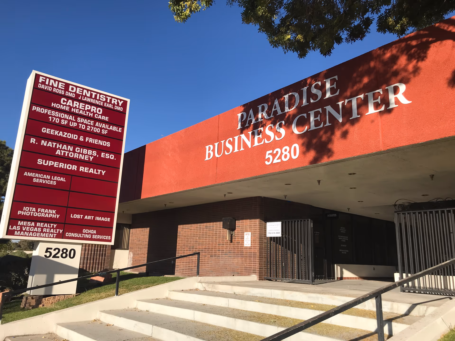 Front exterior of Paradise Business Center with a CarePro Home Health Care Las Vegas NV sign.