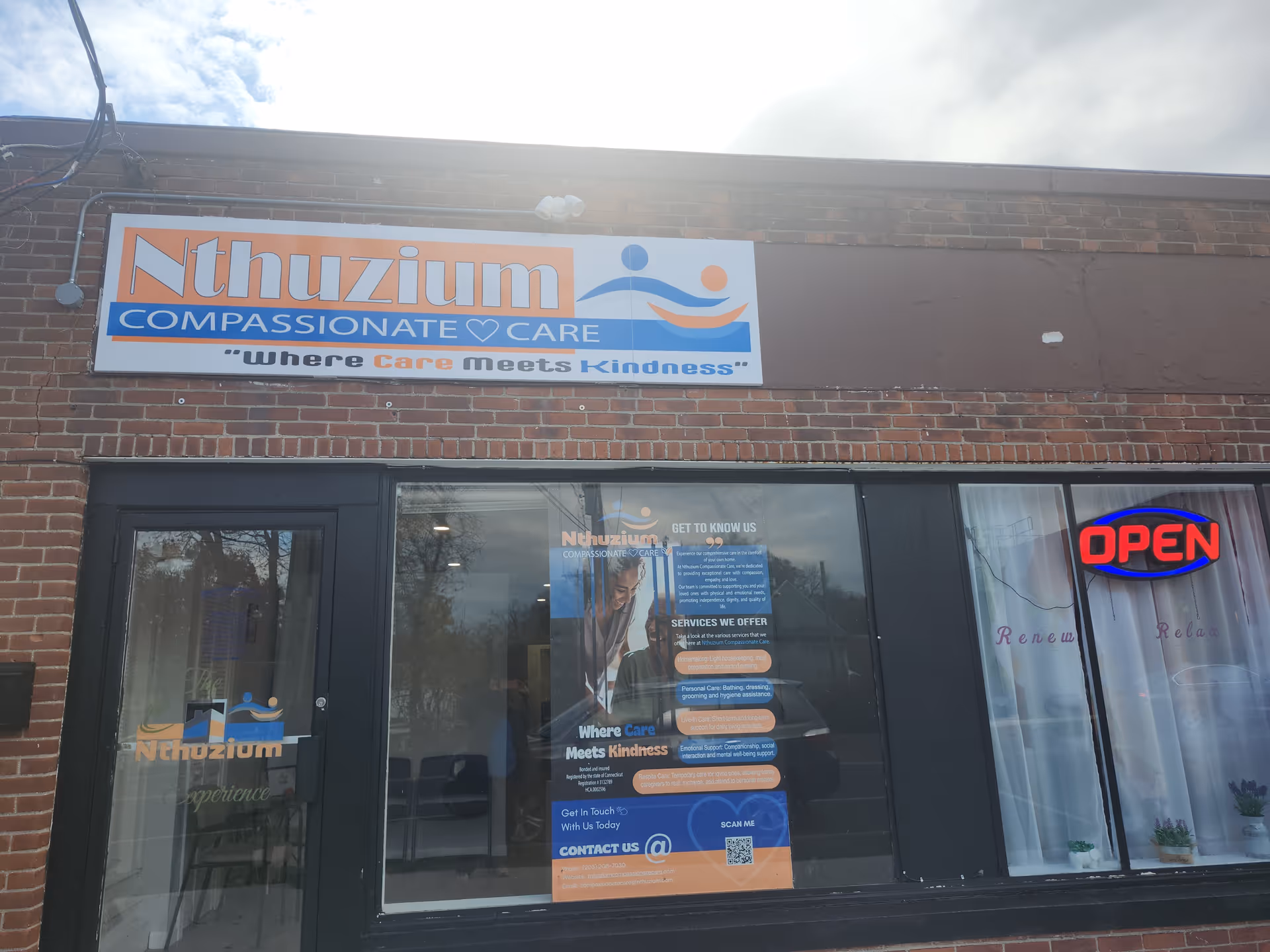 Exterior brick storefront is shown with the Nthuzium Compassionate Care sign.