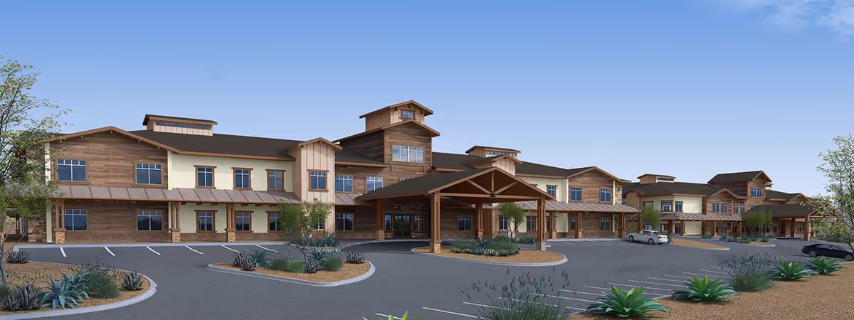 Exterior view of Summerset Senior Living building with parking and covered entrance.
