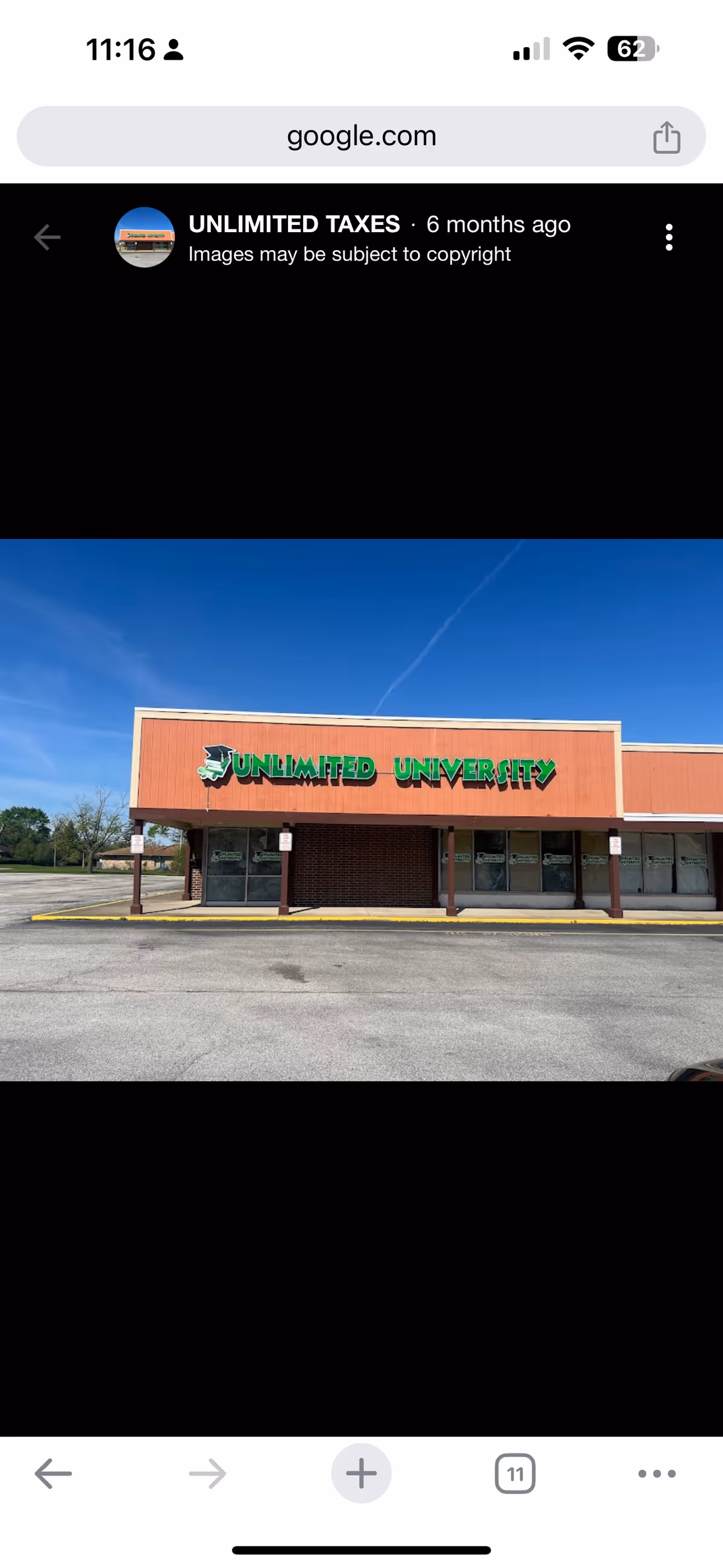 A single-story brick storefront with green 'Unlimited University' sign on a sunny day.