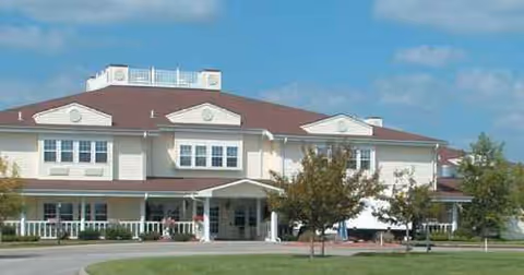 Exterior of River Pointe Health Campus: a two-story building with white facade and brown roof.