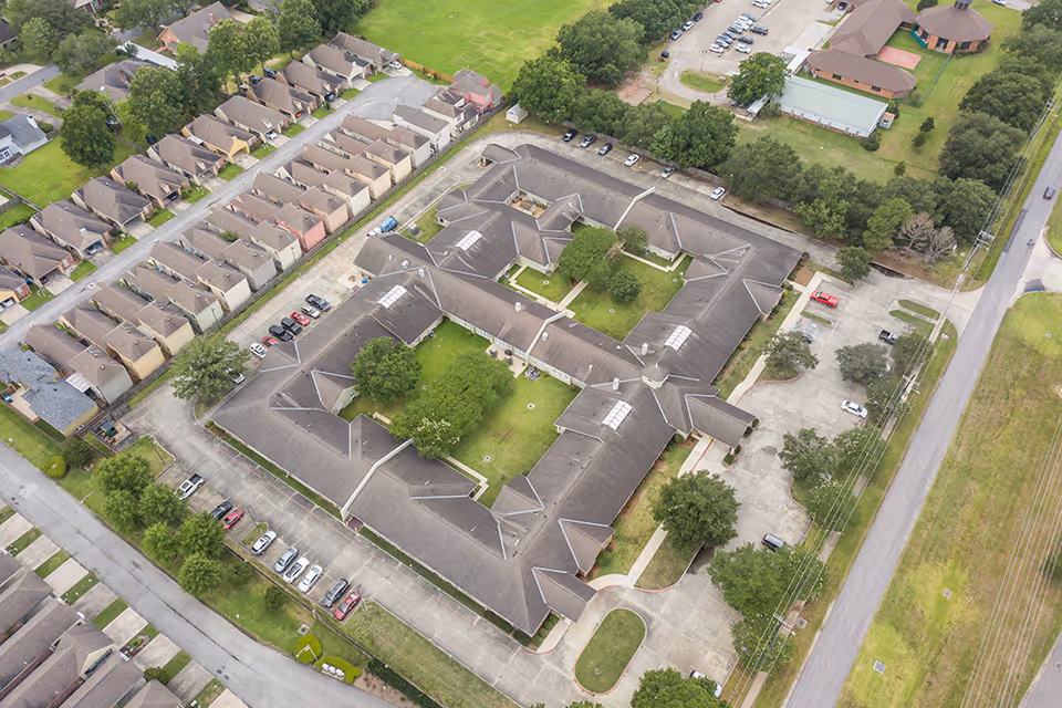 Aerial view of Brookdale Lafayette senior living campus with connected buildings and parking.