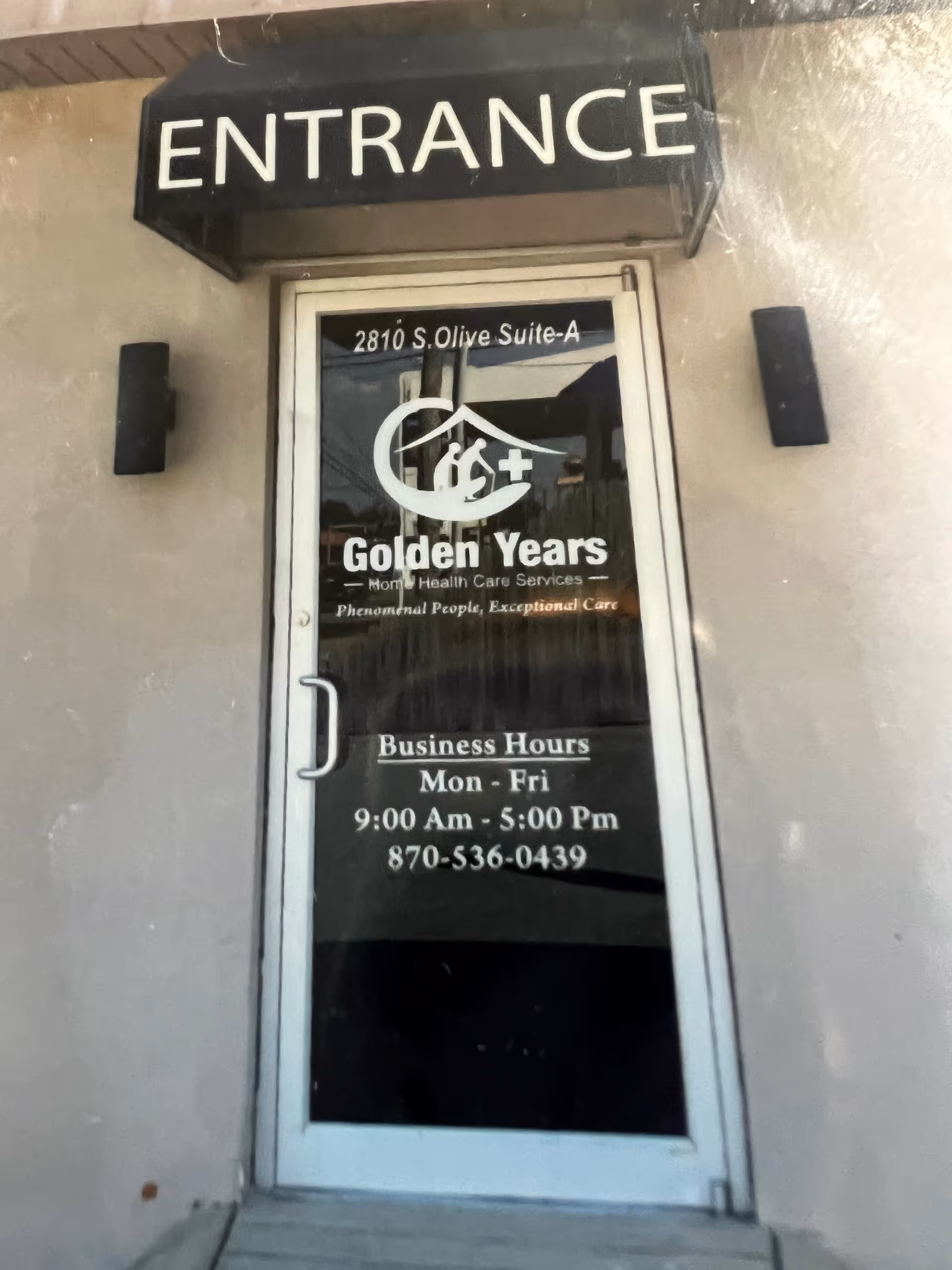 Exterior entrance door displaying Golden Years logo and business hours.