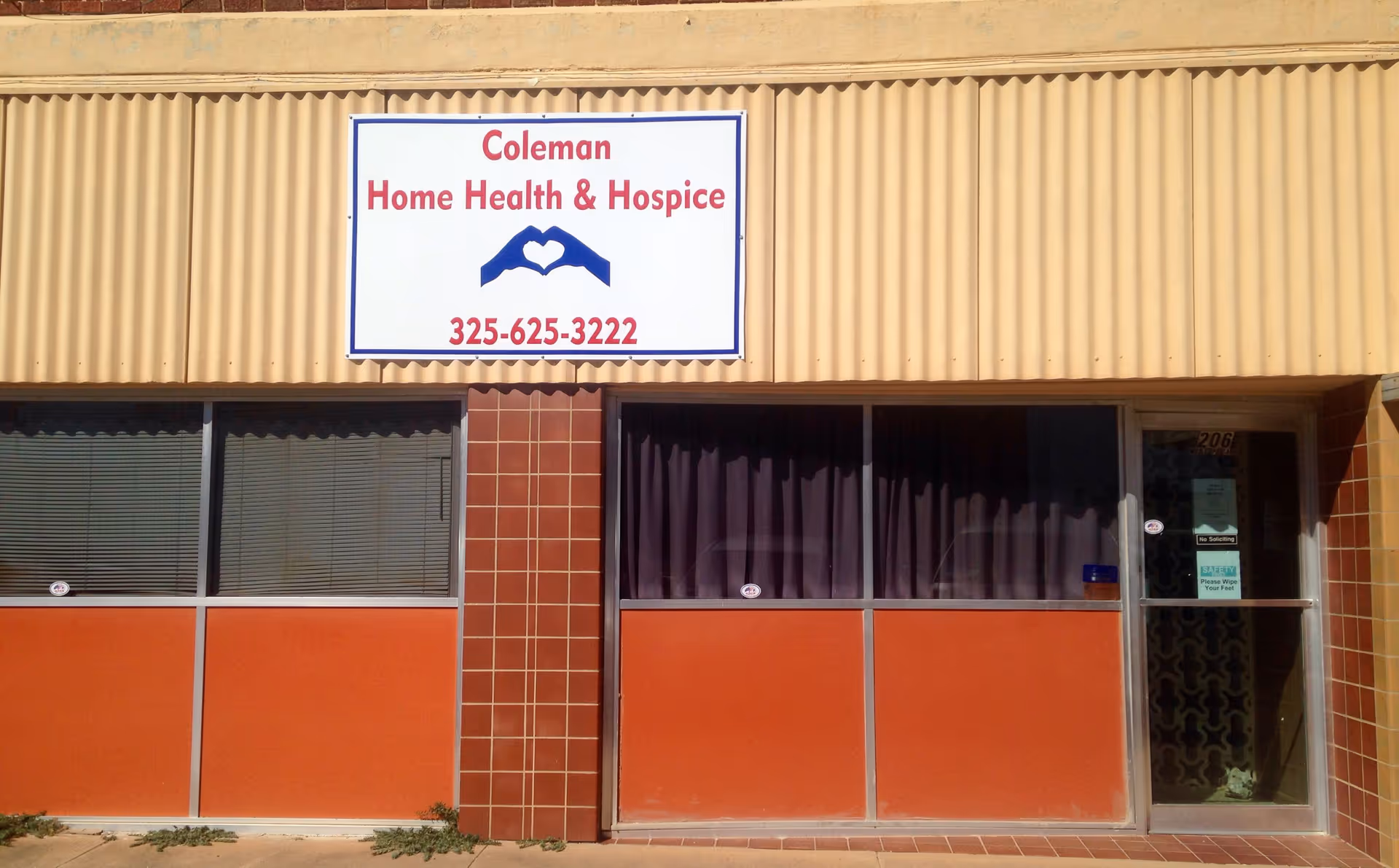 Exterior view of Coleman Home Health & Hospice building with sign.