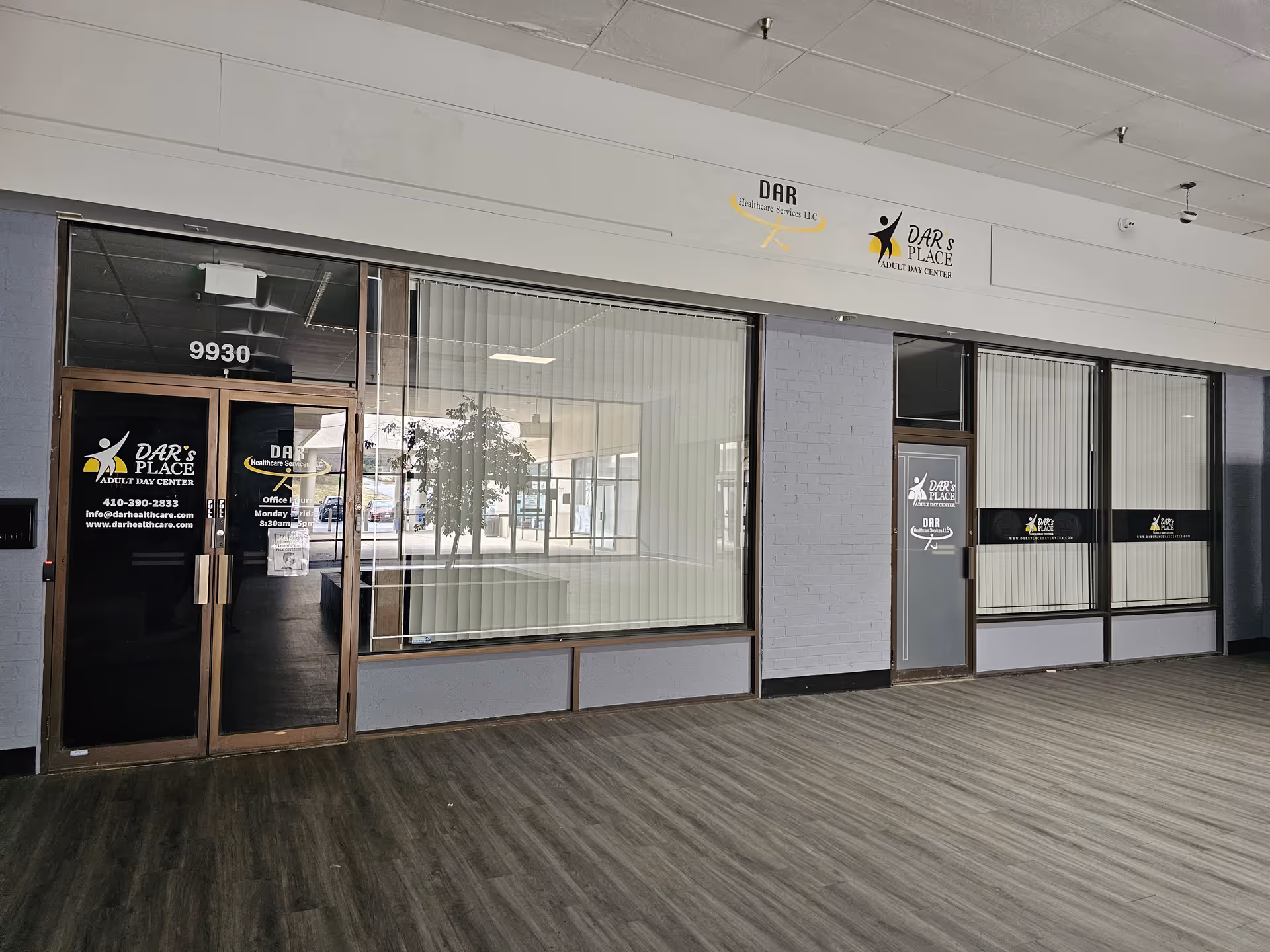 Storefront for DAR Healthcare Services LLC with glass doors and signage in a mall corridor.