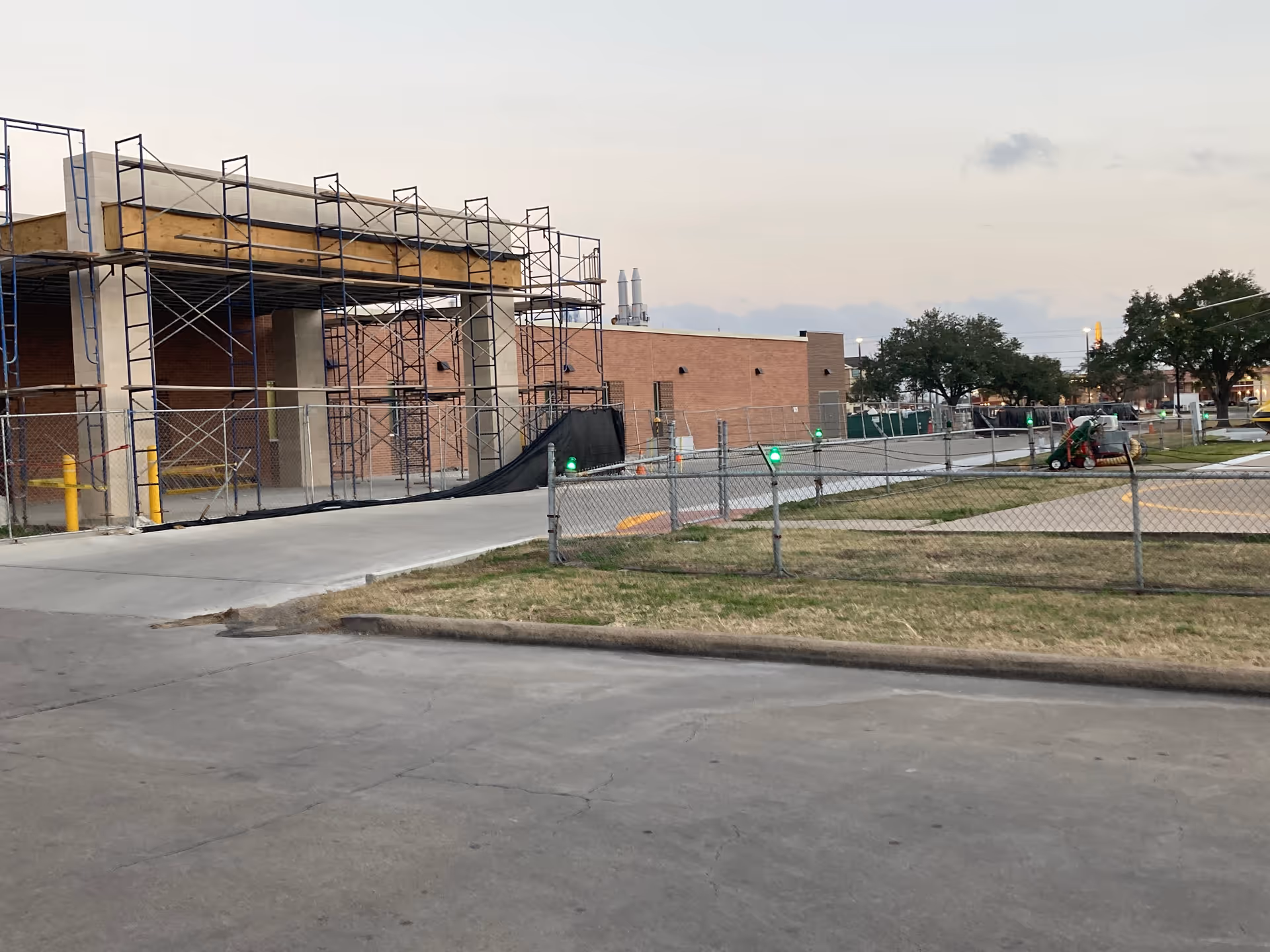 Exterior of Citizens Medical Center under construction with scaffolding and fencing.