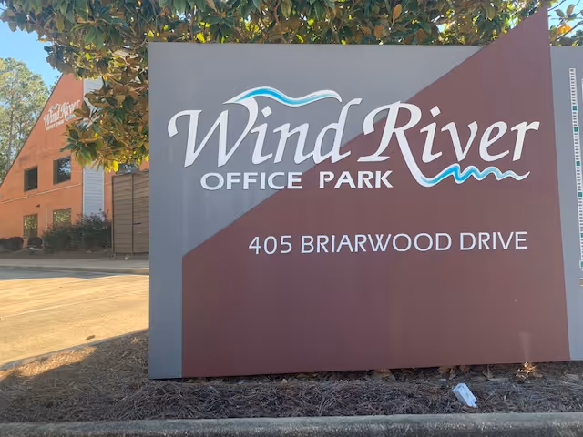 Large sign reading Wind River Office Park with address 405 Briarwood Drive
