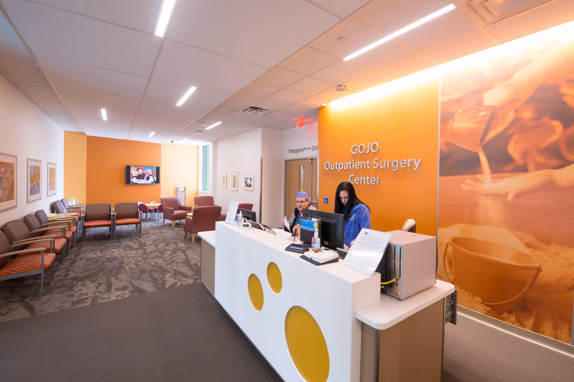 Reception area of an outpatient surgery center with a front desk and seating