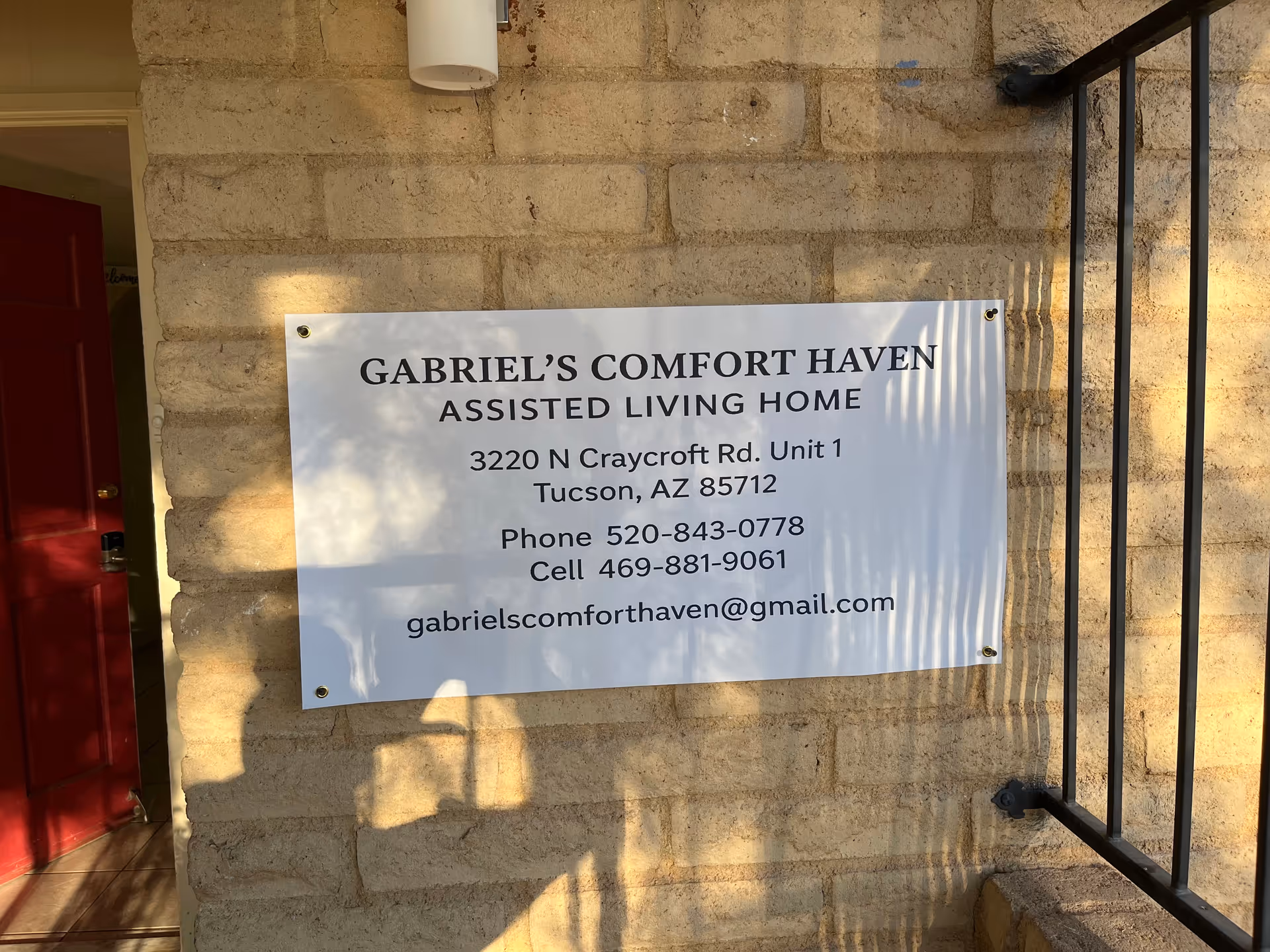Sign on brick exterior wall advertising Gabriel's Comfort Haven Assisted Living Home.