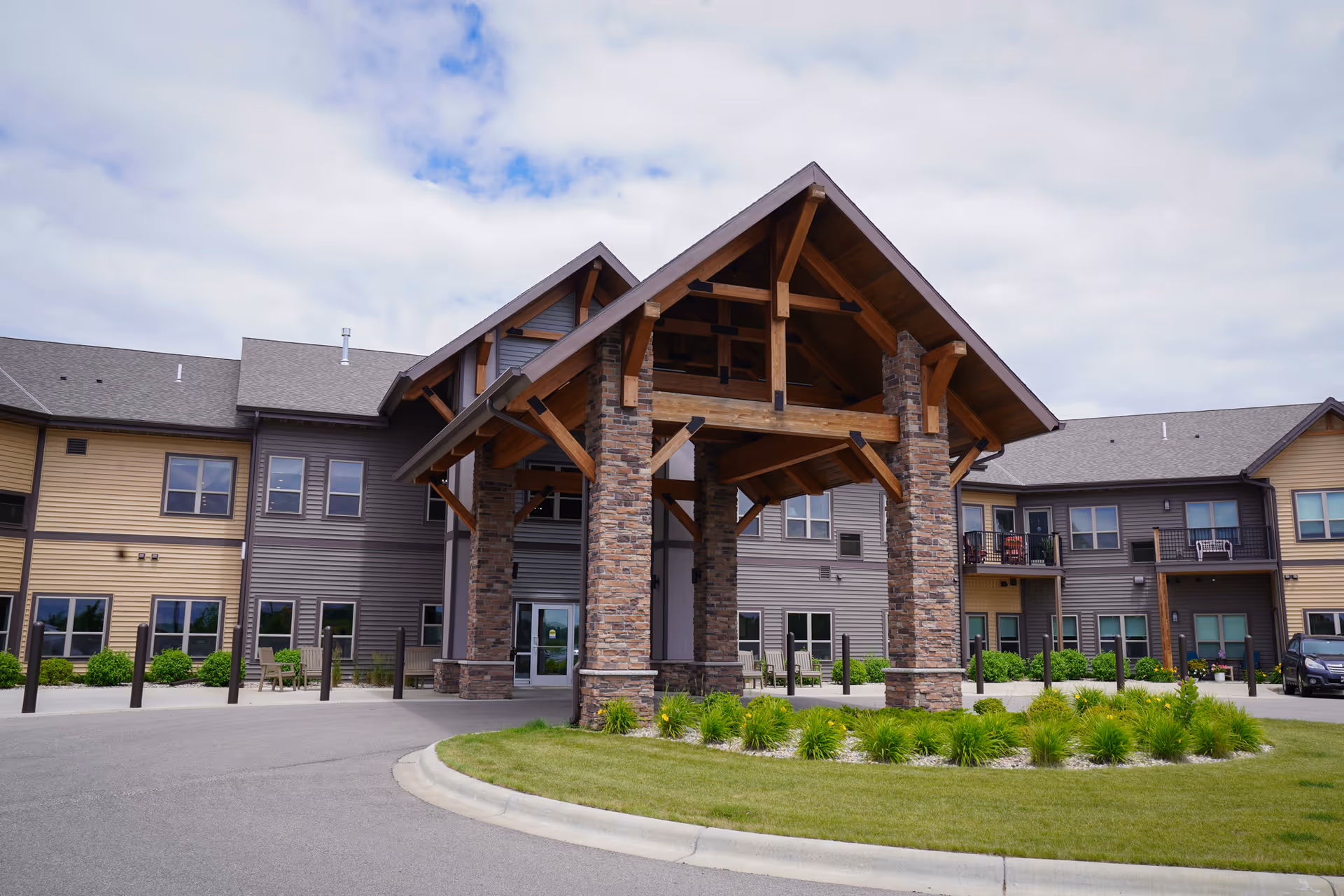 Exterior view of Bethesda North Pointe with a stone entrance and landscaped roundabout.