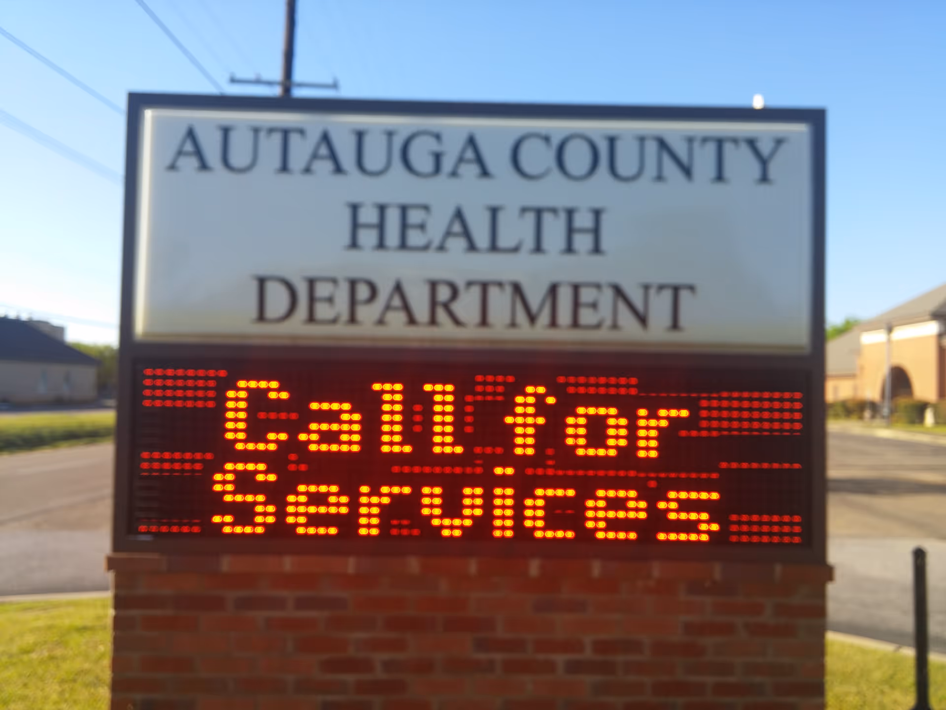 Exterior sign for Autauga County Health Department with a red LED message.