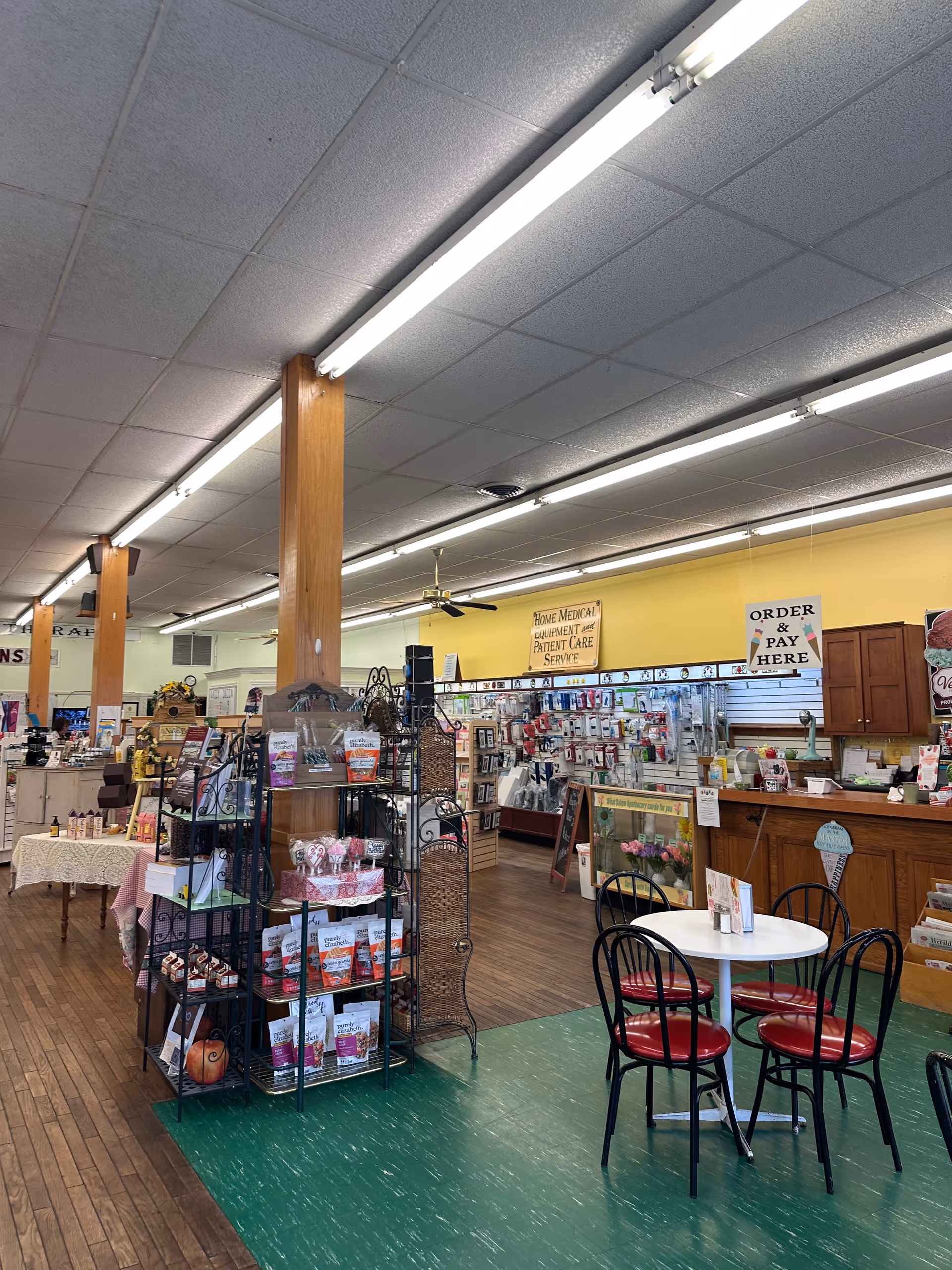 Interior of Salem Apothecary in a senior living facility with shelves, checkout area, and seating.