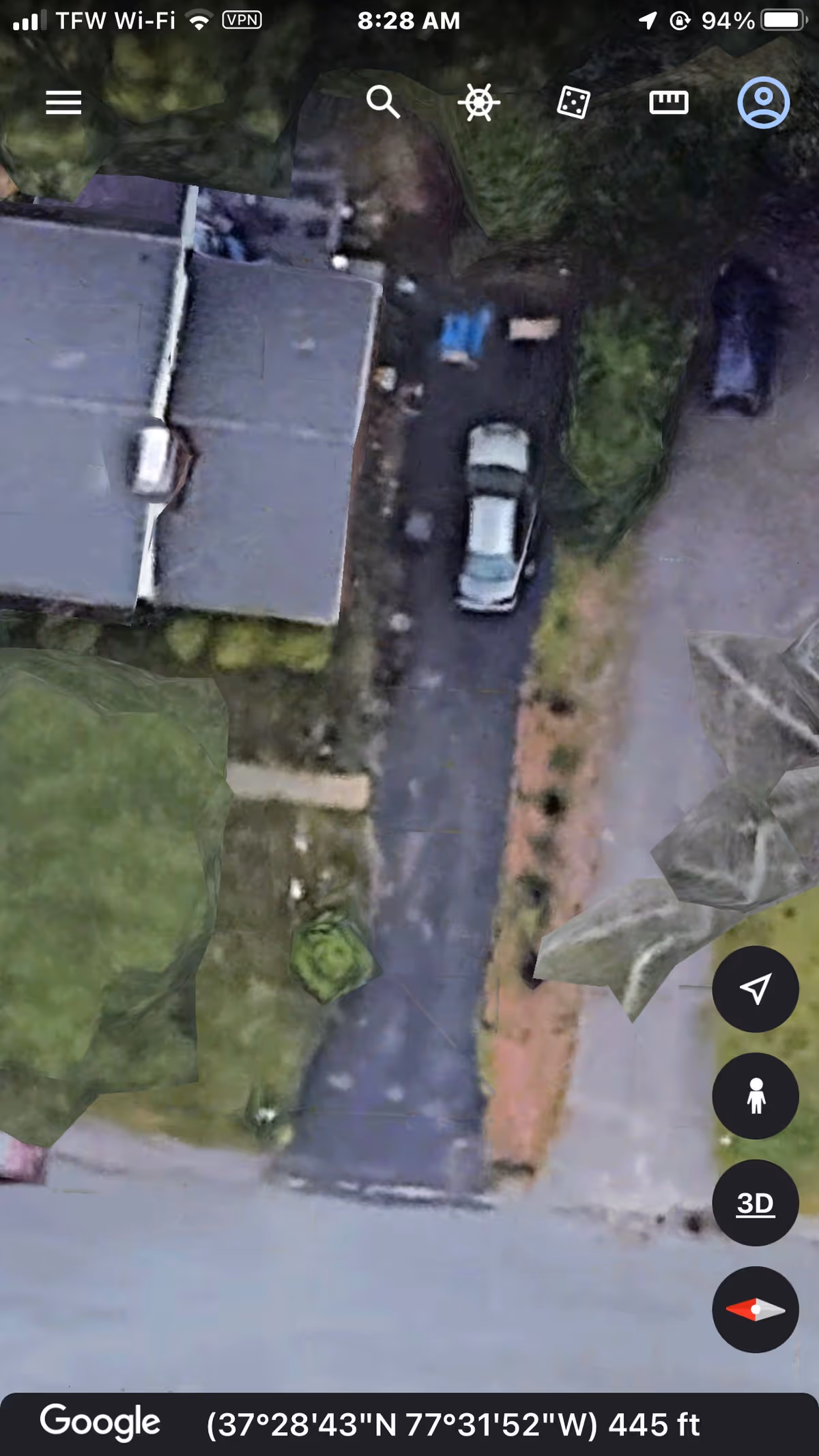Aerial view of the facility exterior with parking along a driveway.