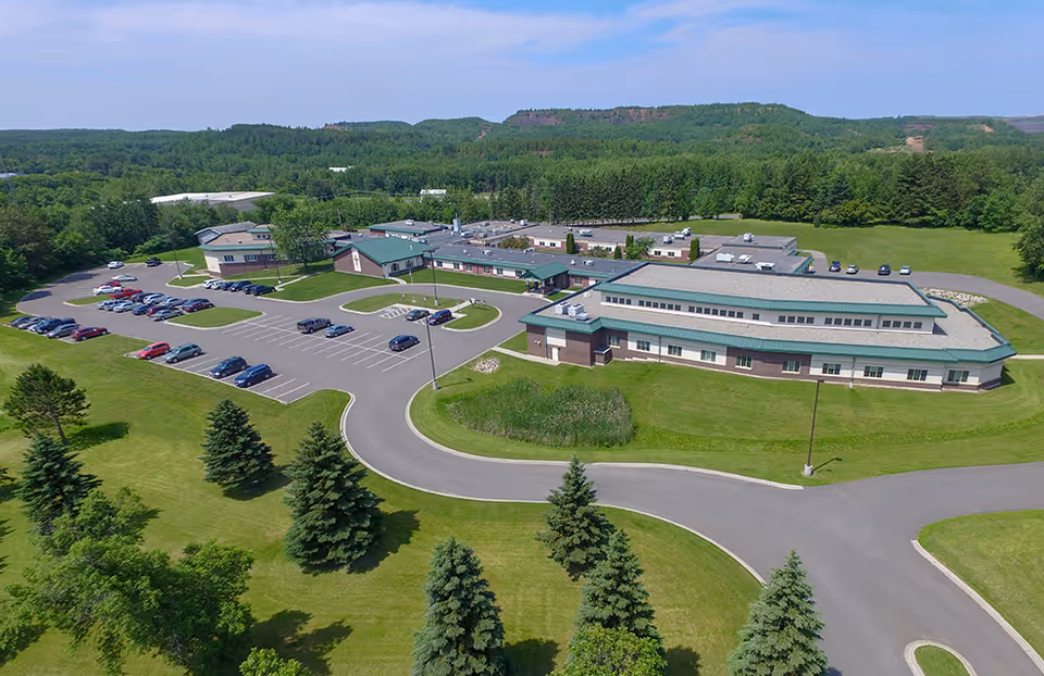 Aerial view of Guardian Angels Health & Rehab Center campus with parking and green grounds.