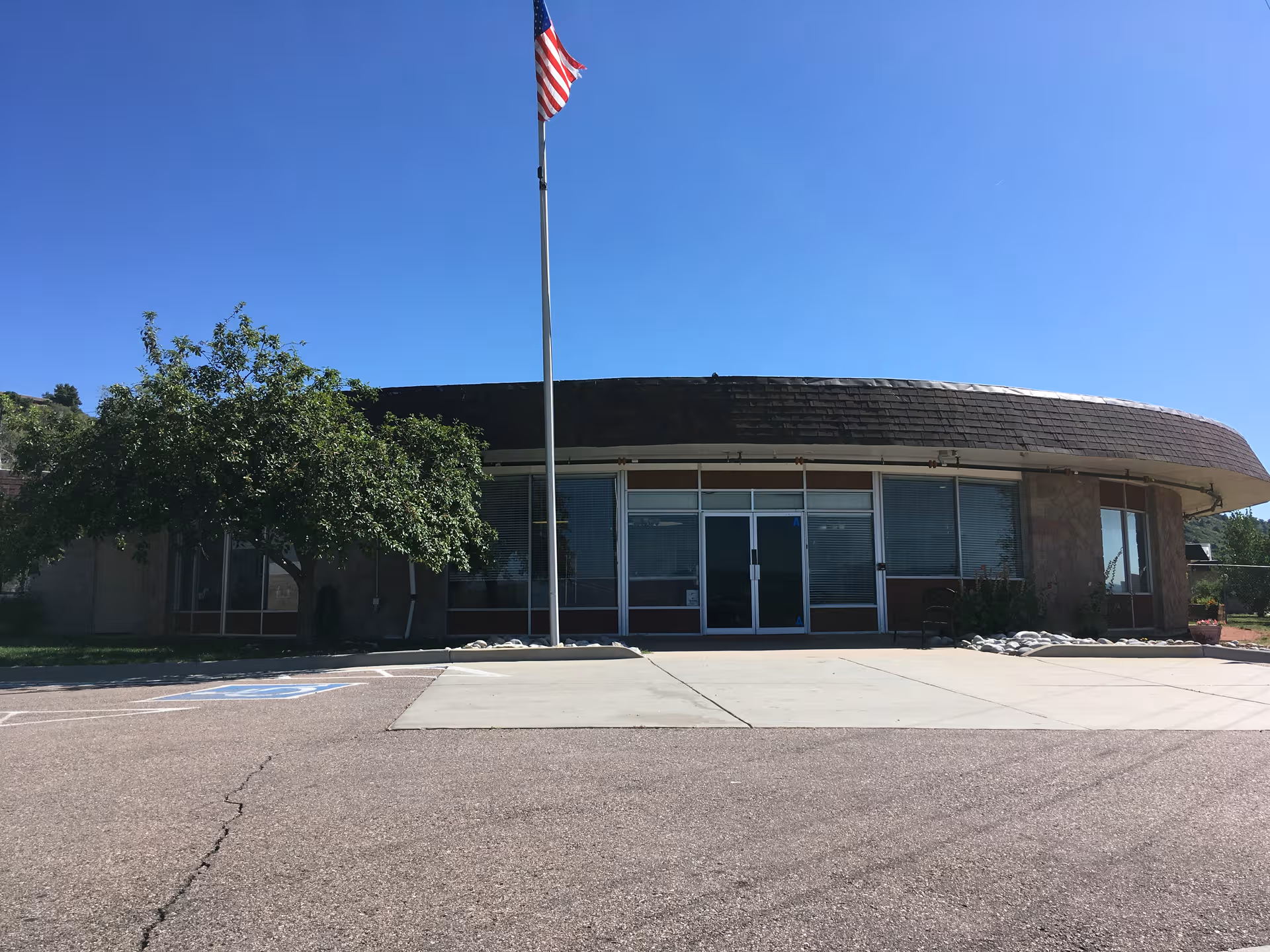 Front view of Silver Heights Skilled Nursing and Rehabilitation building with flagpole