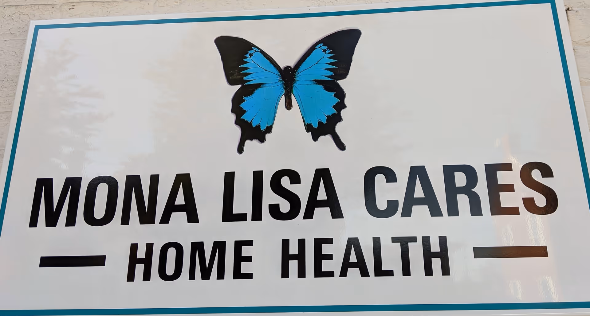 Sign reads Mona Lisa Cares Home Health with a blue butterfly graphic