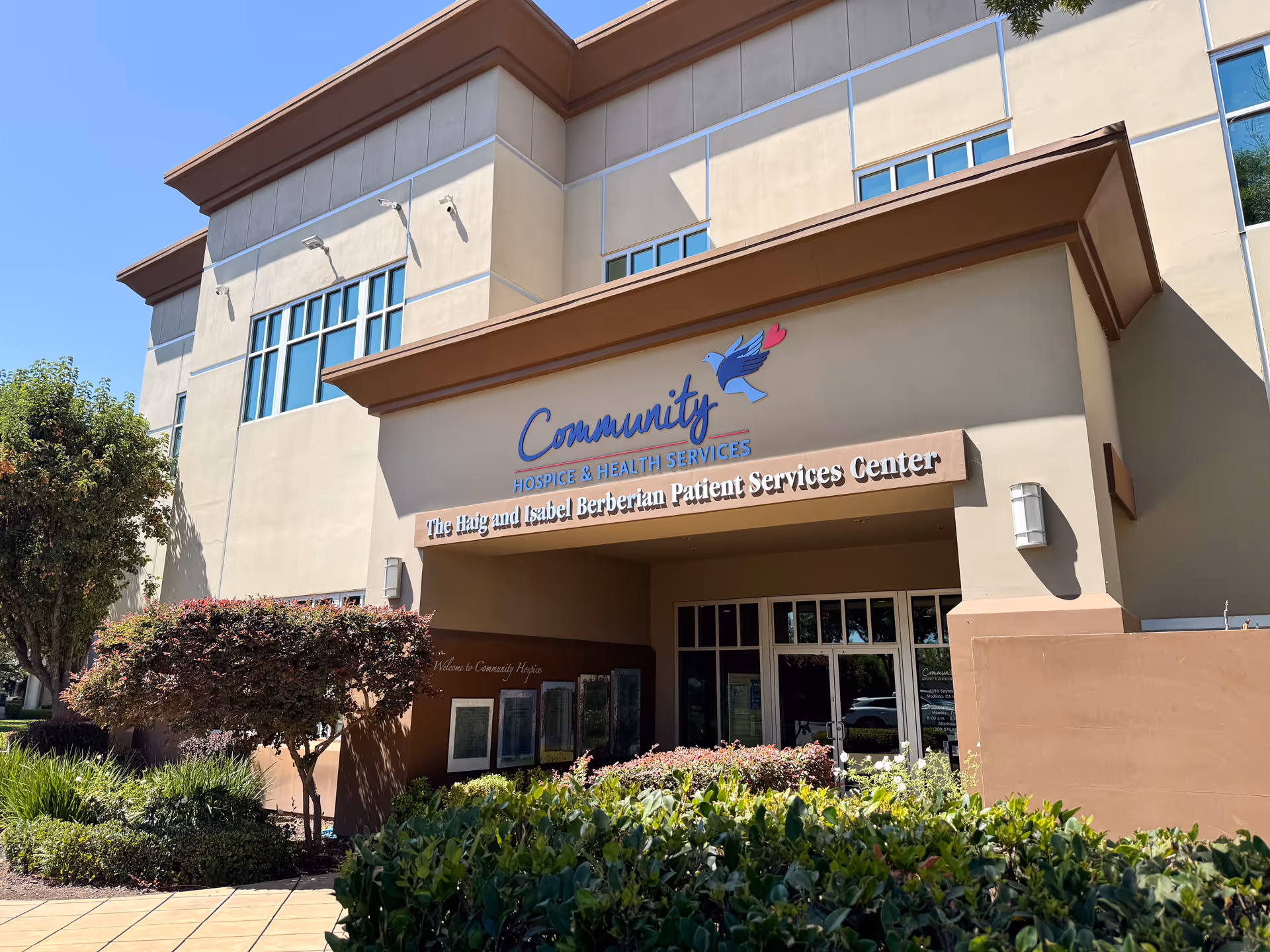 Exterior view of Community Hospice & Health Services building with entrance and landscaping.