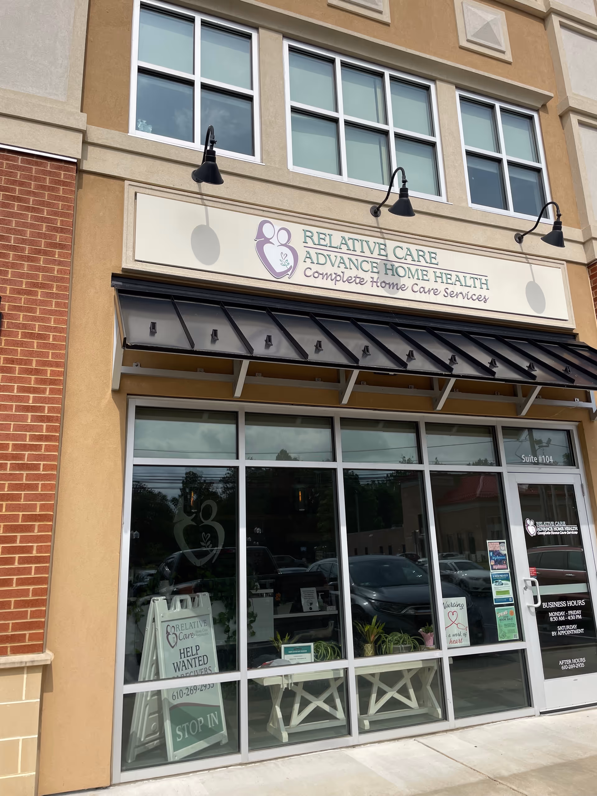 Facade of Relative Care LLC storefront with large windows and a black awning.