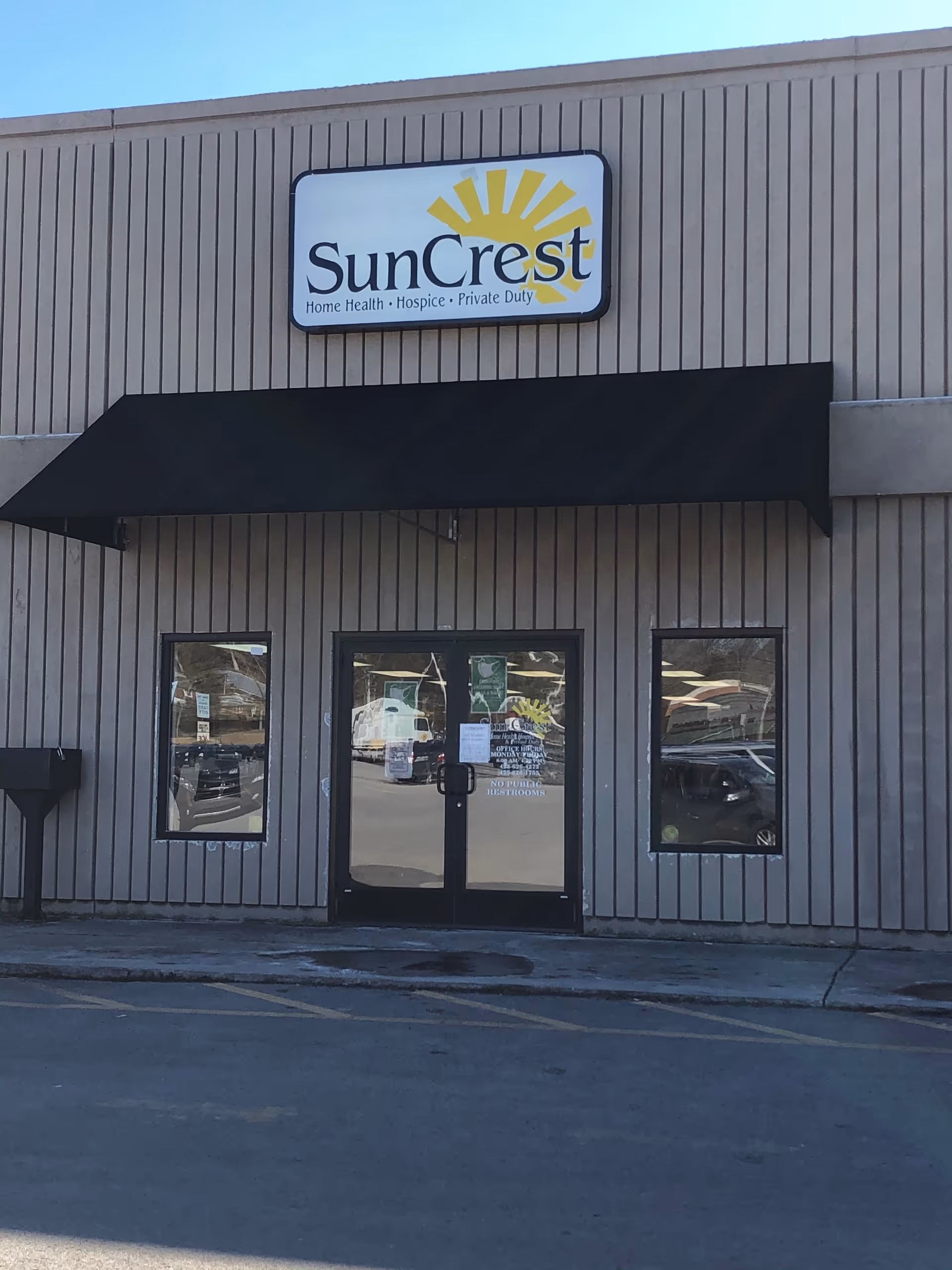 SunCrest entrance with double doors and a large SunCrest sign on the front