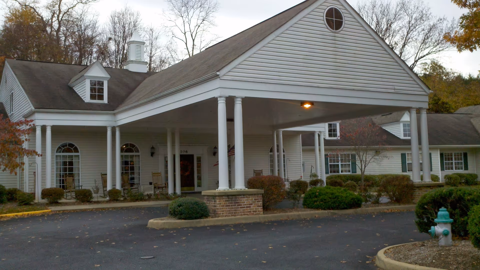 White, columned building exterior of Lavender Hills Front Royal Campus with a covered entrance.