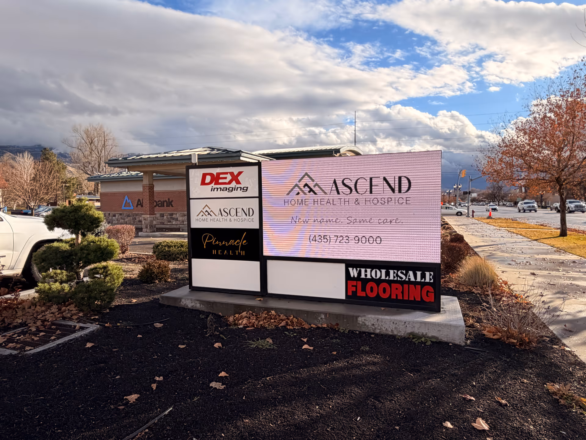 Outdoor view of Ascend Home Health & Hospice sign with landscaping.