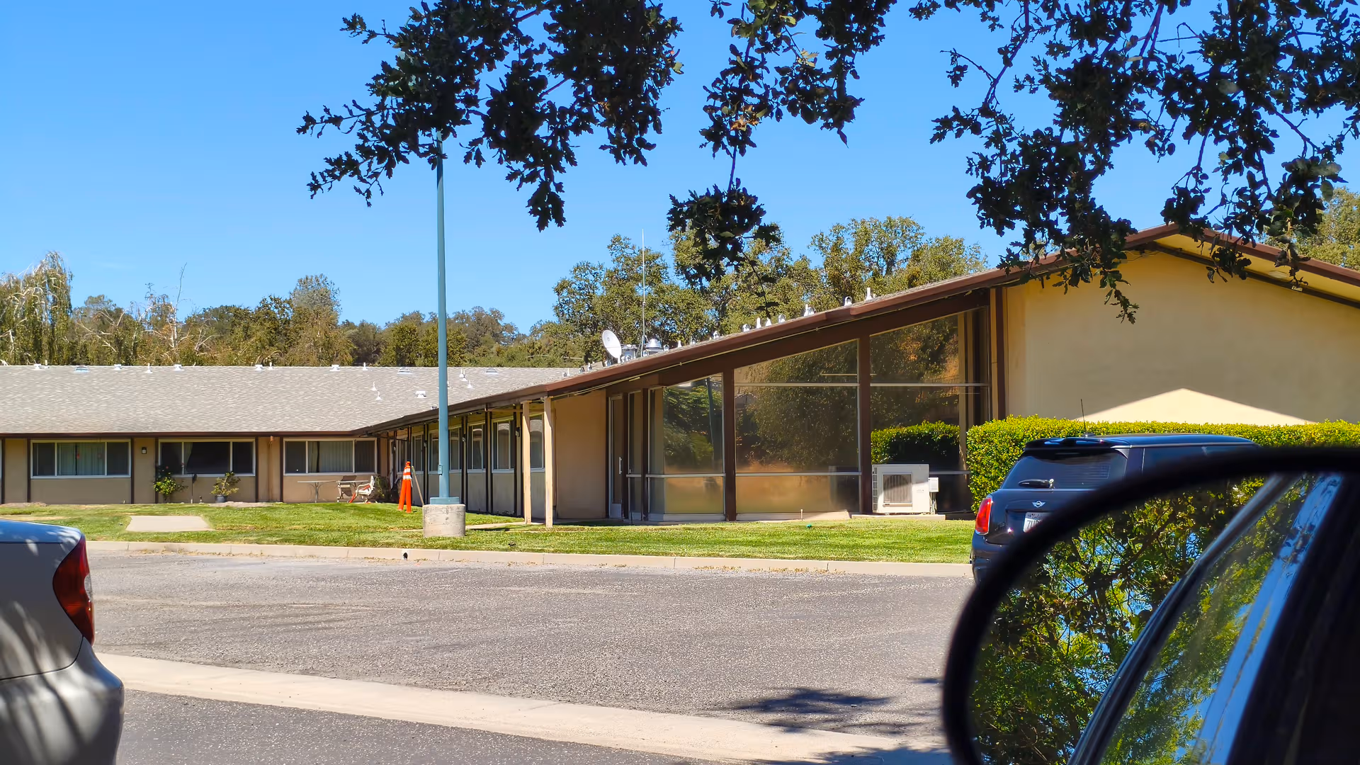 Front view of Golden San Andreas Care Center, a single-story building with a glass facade.
