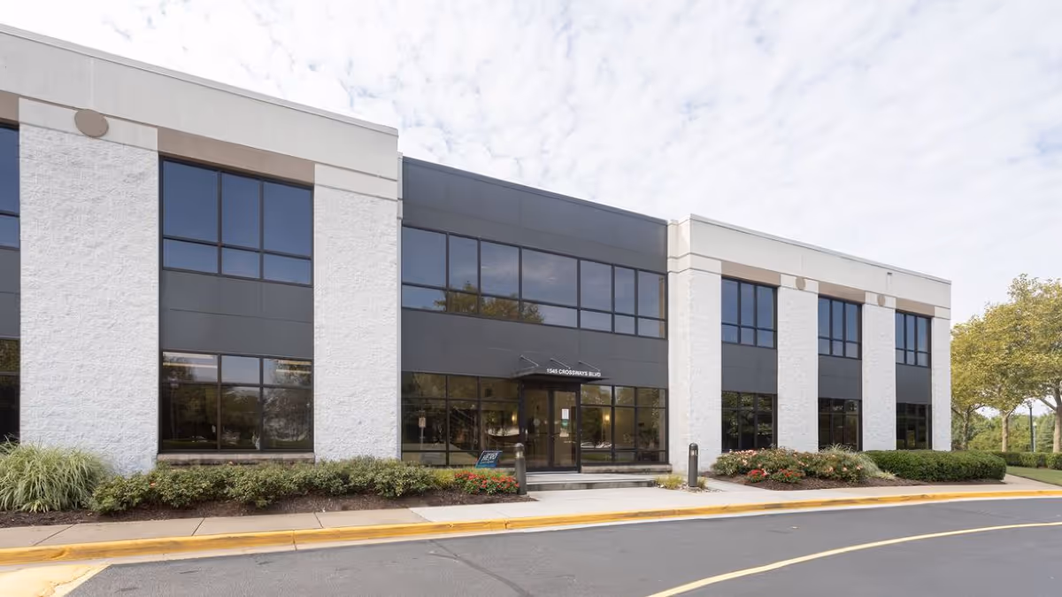Exterior of The Heart of Care Home Healthcare LLC building with large windows and landscaping.