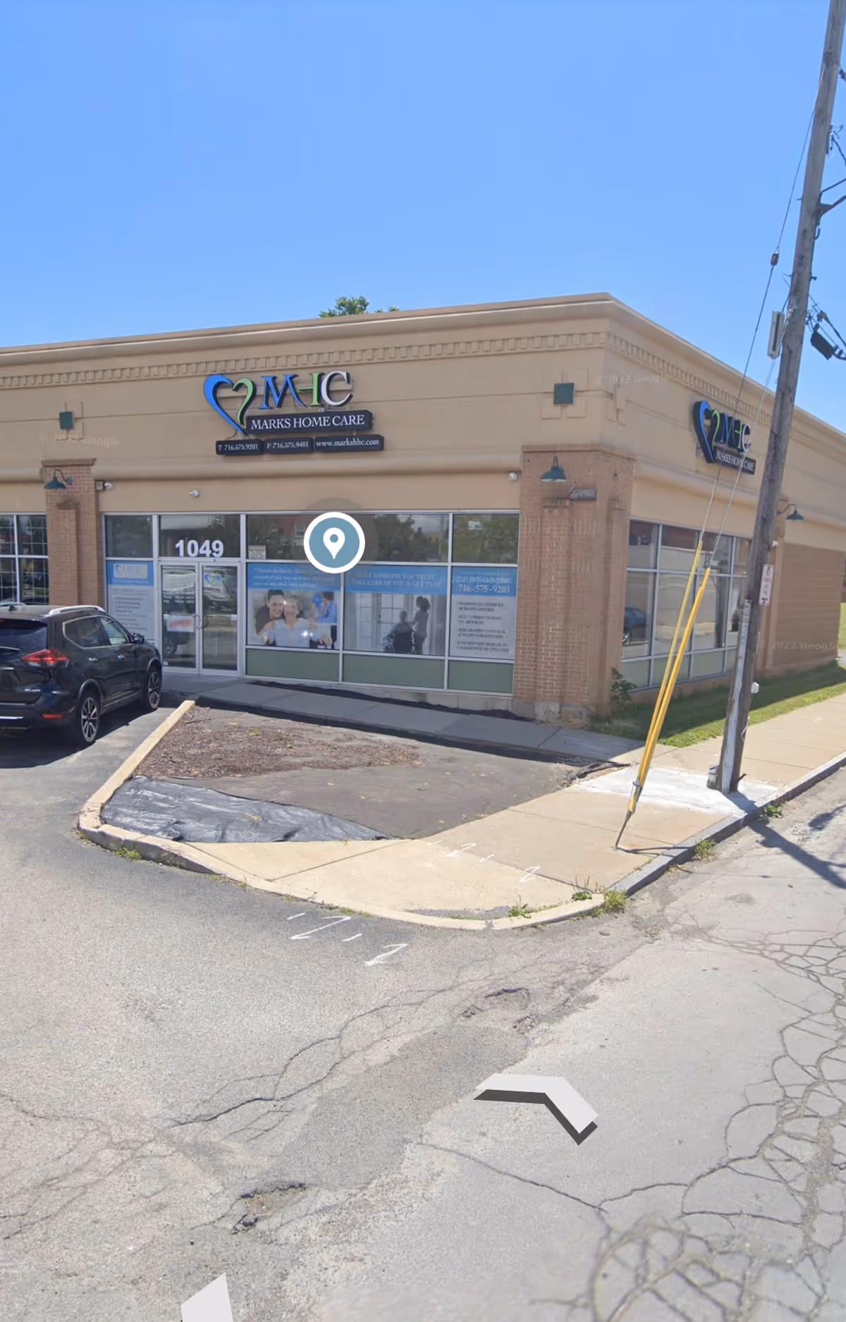 Exterior view of Marks Home Care Agency Buffalo building with storefront windows and signage.