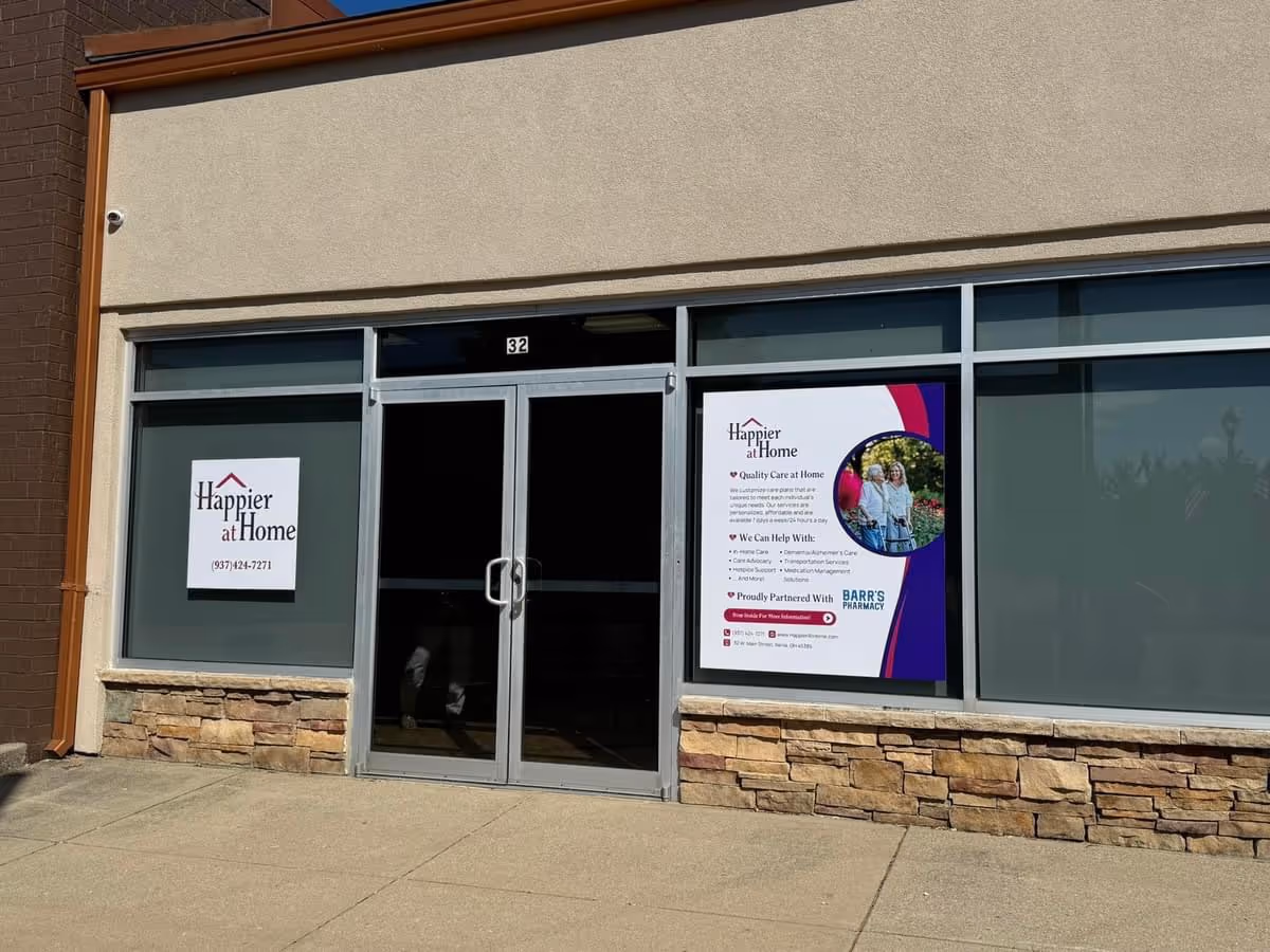 Front view of Happier at Home Southwest, OH storefront with glass doors and posters.