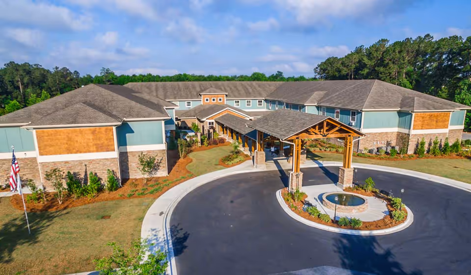 Aerial view of Oaks at Pooler exterior building with circular driveway and entrance canopy.