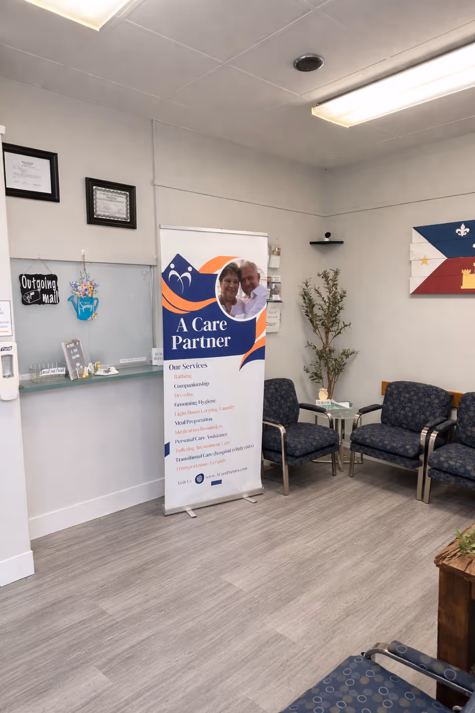 Indoor lobby area with a Care Partner banner and blue patterned seating.